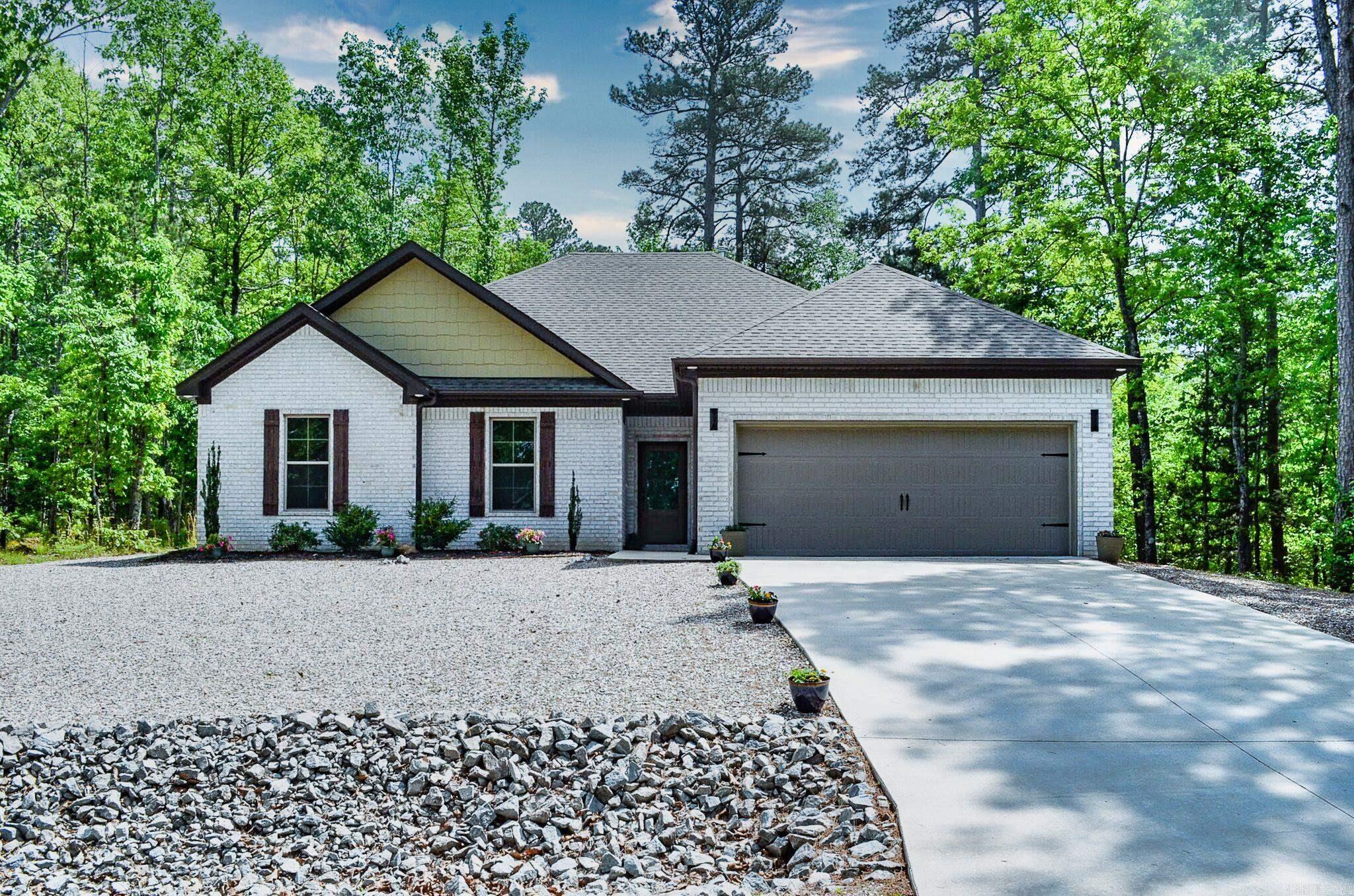 Price reduced over $20,000—motivated seller! This move-in-ready home sits on a quiet street and features a well-designed, flowing floor plan. Enjoy easy access to Highway 7 and the Glazypeau Gate. Plus, you are under 10 minutes from Walmart and local businesses. Do not miss out on this well-maintained property! Largest private community in U.S.  features 11 lakes and 9 golf courses.  Over 26,000 acres in the foothills of the Ouachita foothills.