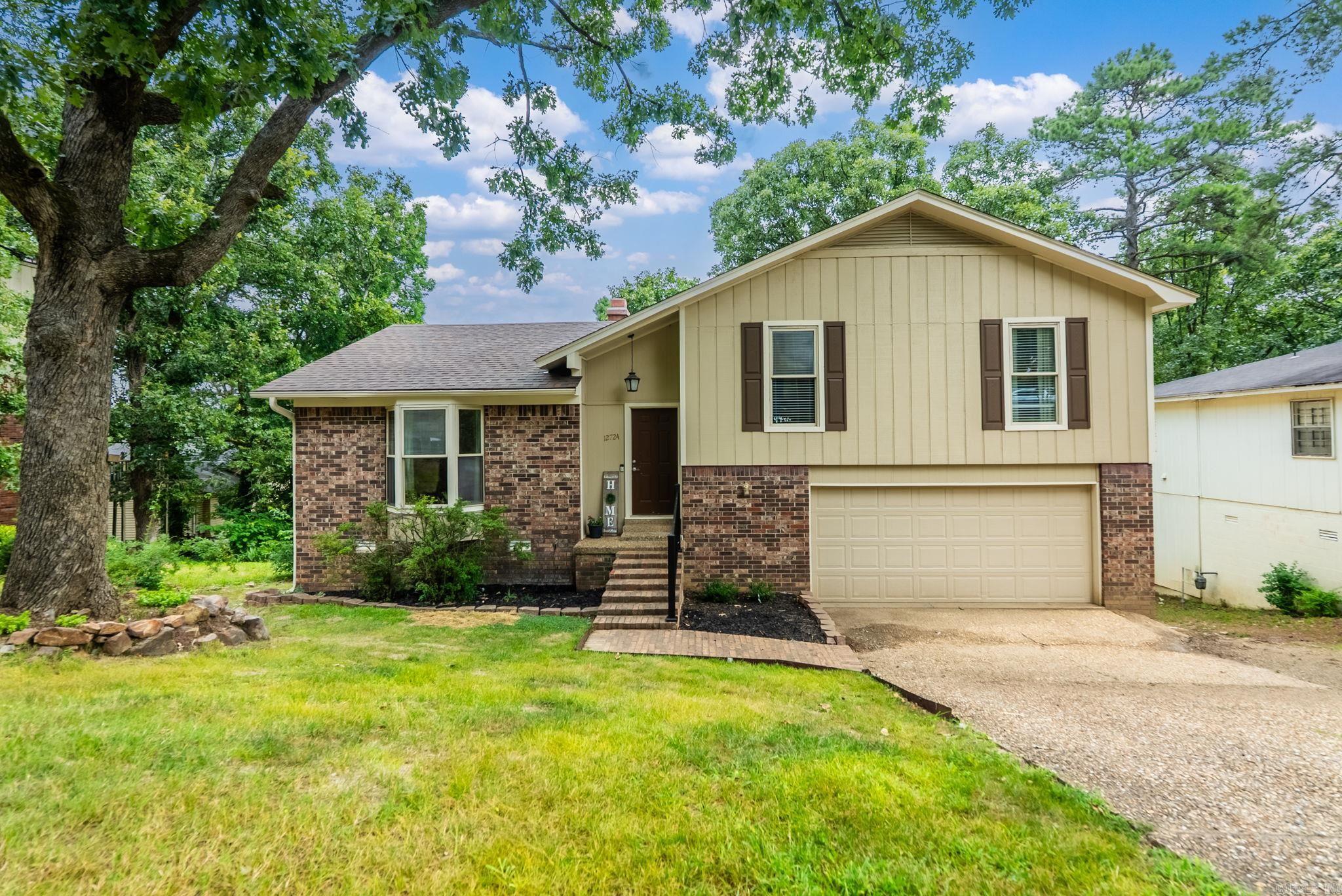 Welcome home! This charming 3-bedroom, 2-bathroom property in the heart of West Little Rock is completely move-in ready and waiting for its next family. Situated in the highly desirable and top-rated Don Roberts School District.  Fresh exterior  paint and new Luxury Vinyl Tile (LVT) flooring in the main living area make this home shine  New dishwasher makes clean up a breeze, and the ultimate peace of mind with a roof newly replaced in 2021. Step out onto your back porch to take in a gorgeous, peaceful bird’s-eye view—the perfect spot for your morning coffee or evening relaxation.   Schedule your private showing today and plant your roots in one of WLR's most family friendly neighborhoods!