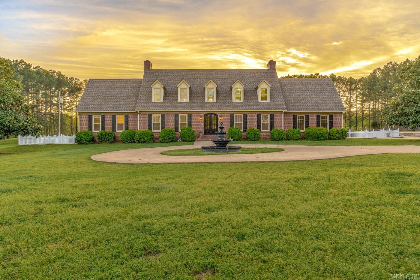 Welcome to 4926 Peachtree Ave. in McDaniel’s Addition of Jonesboro, located in the Brookland School District. This grand estate features an updated 4,288 sq ft Georgian Colonial with extensive upgrades throughout, including updated fixtures, lighting, finishes, bathrooms and kitchen. The home offers spacious living areas designed for both comfort and entertaining. Situated on 12.80 +/- acres of beautifully landscaped and wooded grounds, you’ll enjoy a stocked pond with dock, a bubbling creek, and an in-ground pool with cabana and outdoor kitchen. The property also includes an impressive 80x50 shop building that is heated and cooled and features its own bathroom—perfect for a workshop, storage, or business use. The second detached building a garage has been upgraded it is insulated. The back was converted to stables with 2 large stalls current owners used for their horses. With a blend of open land and mature trees, this property provides privacy, functionality, and scenic surroundings, all while being conveniently located. A rare opportunity to own a fully improved estate with exceptional amenities.