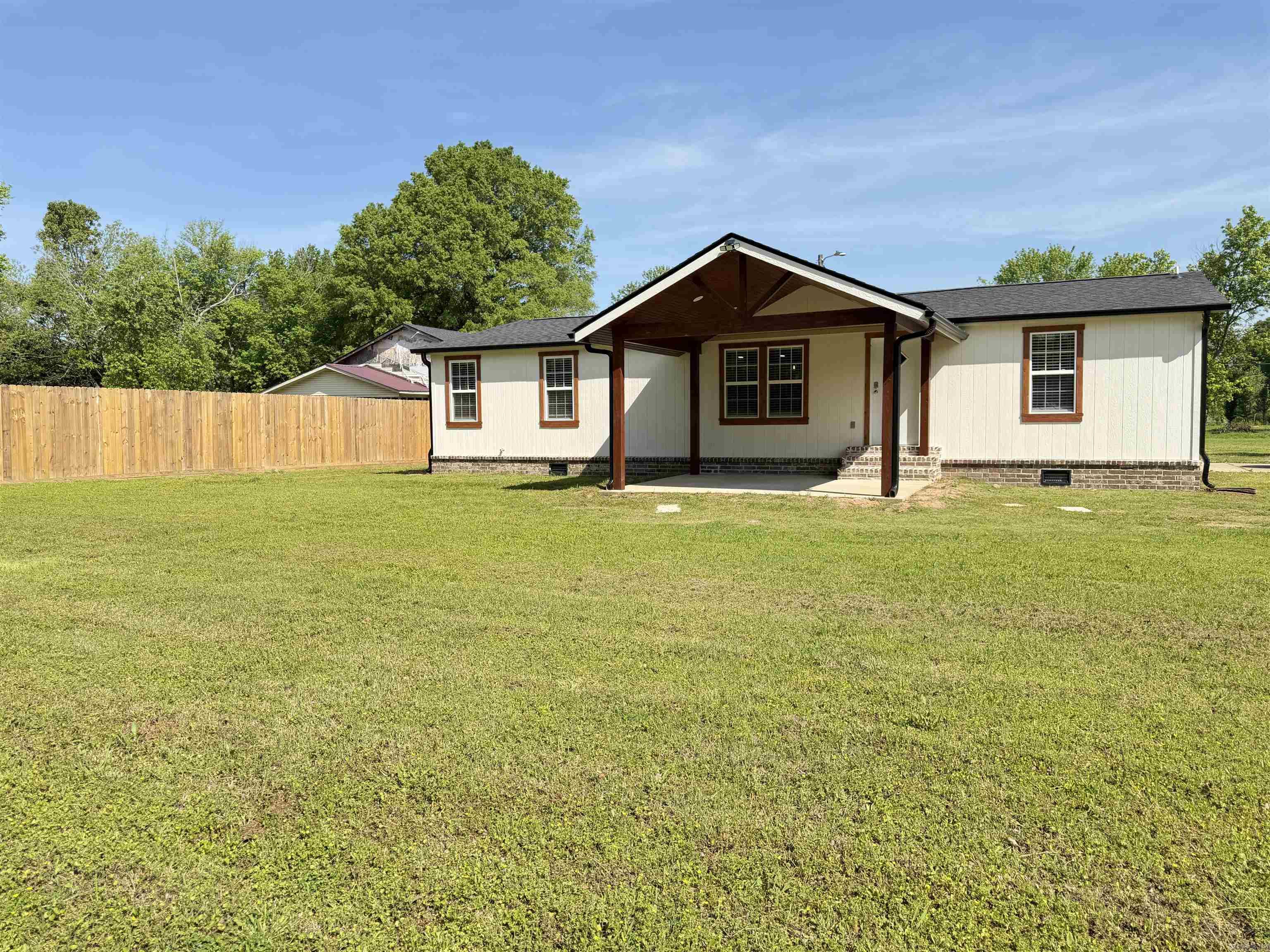 Completely updated, this beautifully renovated home blends modern comfort with farmhouse style. Vaulted ceilings, floating wood shelves & a smart kitchen island lend the open concept kitchen, living, dining rooms to feel spacious & are perfect for entertaining. Take the party outside & enjoy the ample front & back patios, both covered with stunning pine wood ceilings. Major upgrades include EVERYTHING: from the permanent foundation to the roof, this home is completely new, giving you peace of mind for years to come. Bask in country living with an easy commute to LR. Do NOT miss this unicorn of a perfect home on half an acre & schedule your tour today! *sq ft is approx., measuring is encouraged