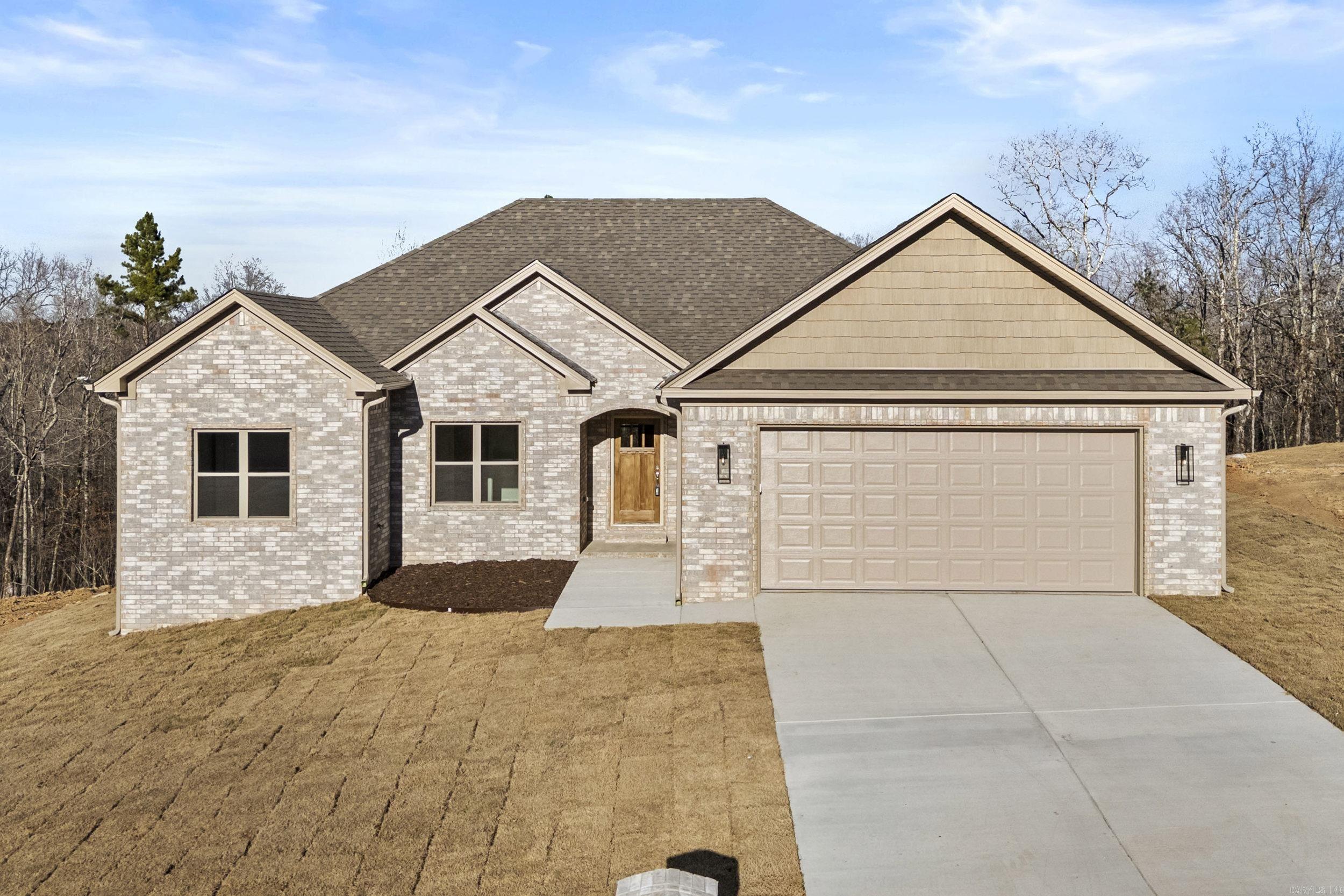 Welcome to 524 Valley Oak Drive! This 4 bedroom/2bath new construction home features a split floor plan with a luxurious primary suite on one side of the home and 3 guest bedrooms on the opposite end of the home. Walking into the home you'll enter a large living room space that blends into the stunning kitchen area, featuring a massive 12 foot island with granite and wall to wall custom cabinetry. The kitchen features stainless steel appliances, a gas range, pantry, and much more! If you come into the home from the garage you've got a laundry/mud room before getting into the kitchen. The home has tons of storage areas including a floored attic space with a full sized stairway for easy access. On top of all the indoor features, this home has an amazing view in the backyard of a creek and heavily wooded area which also provides privacy. This is one you don't want to miss, come check it out today!