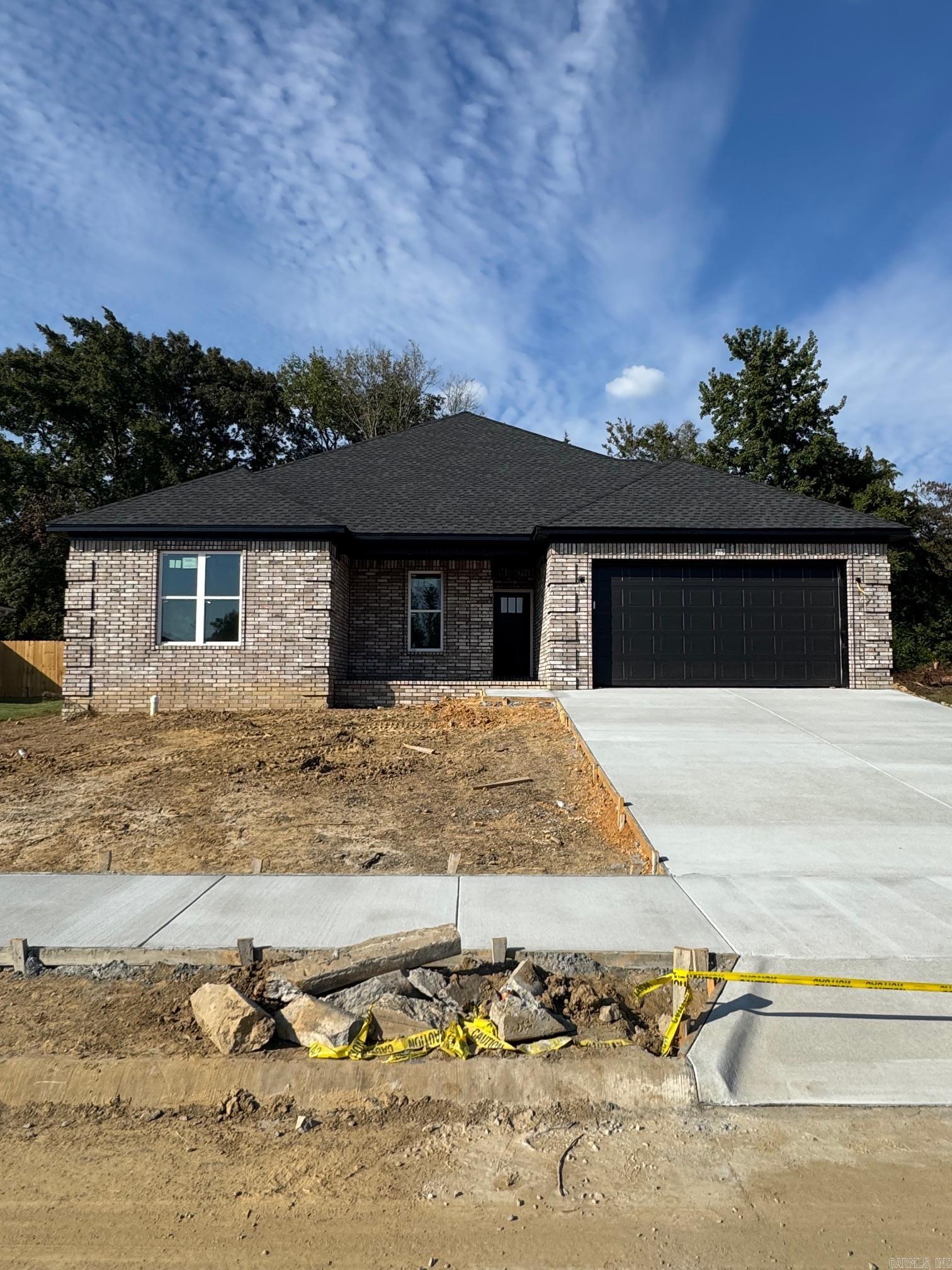VERY MOTIVATED SELLER!!! Open to negotiations! Willing to assist a buyer with concessions and possibly adding or changing details of the house.   Welcome to this stunning new construction all-brick home, perfectly blending modern elegance with comfort. This 4-bedroom, 2-bathroom beauty features spacious rooms and an open floor plan that’s perfect for both everyday living and entertaining. Each of the generously sized bedrooms boasts large closets, providing ample storage for all your needs. The luxury primary suite is a true retreat, offering a spa-like atmosphere with a large soaking tub and a custom-tiled walk-in shower—perfect for unwinding after a long day. The home is bathed in tons of natural light, highlighting the modern colors and high-end finishes throughout, from the standout accent walls to the spacious quartz-topped kitchen island that is sure to be the heart of the home.