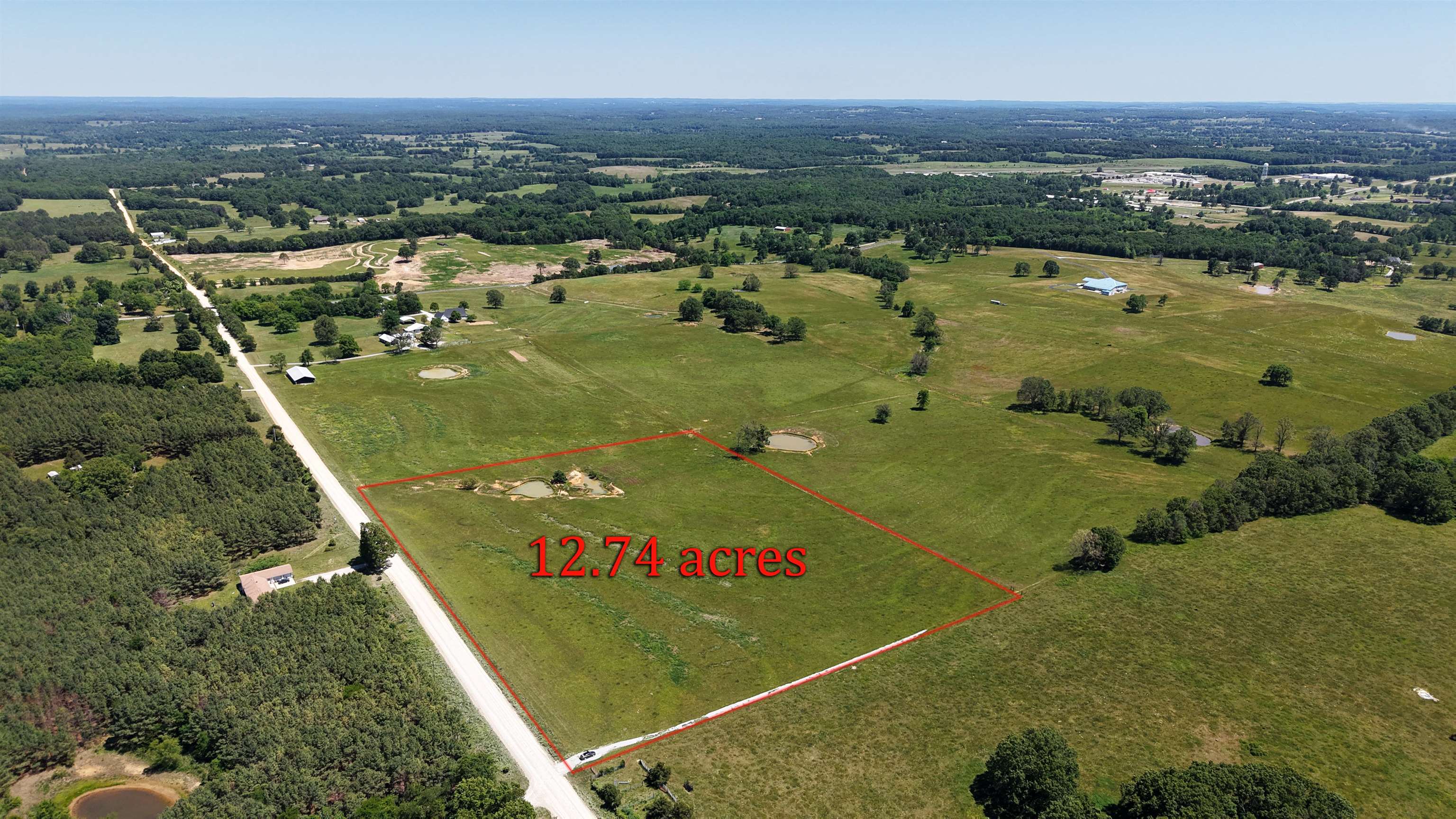 This 12.74-acre tract offers a prime building opportunity in a sought-after rural setting, with the convenience of town just minutes away. Located near schools, a golf course, shopping, and other everyday amenities, it’s an ideal spot for your custom home or hobby farm in the Ozarks of North Central Arkansas.  With electricity and water available, you can move forward with building plans more efficiently. The property is fully fenced and includes a nice pond, creating excellent potential for pastureland, livestock, or small-scale farming.  Opportunities like this are hard to find. This versatile acreage is offered at just $104,900. Additional acreage is available.