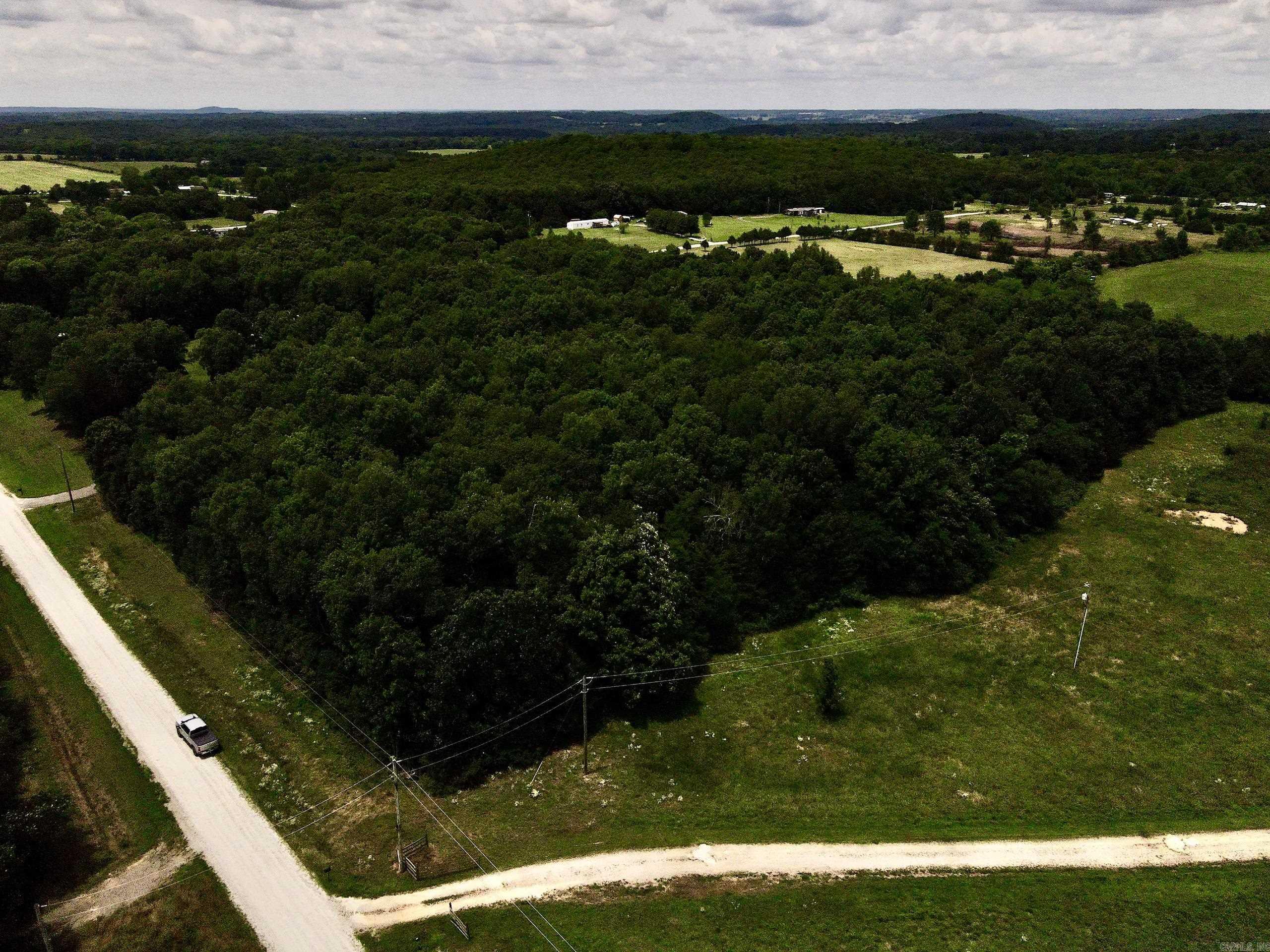 If you're looking for the perfect place to build in the country, this beautiful tract near Rose Bud, Arkansas deserves a closer look. Located on a quiet gravel county road, it offers an ideal combination of privacy, natural beauty, and convenience.  The property features multiple potential building sites across gently rolling terrain, allowing flexibility for a custom home, barndominium, cabin, or hobby farm. Mature timber scattered throughout creates a peaceful, park-like setting with shade, privacy, and natural beauty.  Utilities are available at the road, including electricity, county water, and high-speed internet, making future development straightforward and convenient.  The area supports abundant wildlife, and the blend of timber and open ground creates a quiet rural atmosphere while maintaining easy usability for building.  Located within the Rose Bud School District, the property offers country living with convenient access to schools, shopping, and everyday amenities. Whether you're seeking a future homesite, investment property, or peaceful retreat, this tract offers an excellent opportunity in a desirable location.