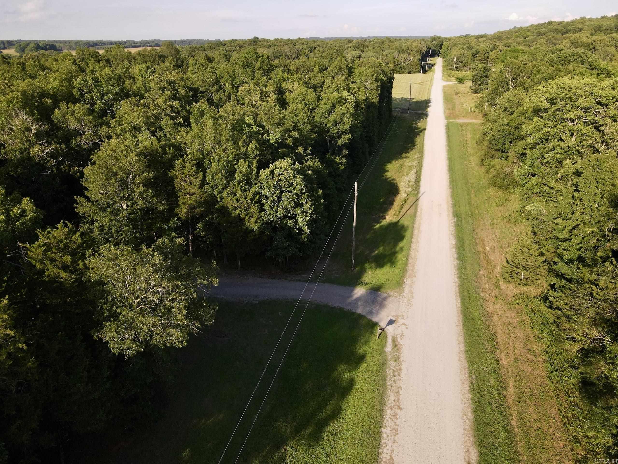 If you're looking for the perfect place to build in the country, this beautiful tract near Rose Bud, Arkansas deserves a closer look. Located on a quiet gravel county road, it offers an ideal combination of privacy, natural beauty, and convenience.  The property features multiple potential building sites across gently rolling terrain, allowing flexibility for a custom home, barndominium, cabin, or hobby farm. Mature timber scattered throughout creates a peaceful, park-like setting with shade, privacy, and natural beauty.  Utilities are available at the road, including electricity, county water, and high-speed internet, making future development straightforward and convenient.  The area supports abundant wildlife, and the blend of timber and open ground creates a quiet rural atmosphere while maintaining easy usability for building.  Located within the Rose Bud School District, the property offers country living with convenient access to schools, shopping, and everyday amenities. Whether you're seeking a future homesite, investment property, or peaceful retreat, this tract offers an excellent opportunity in a desirable location.