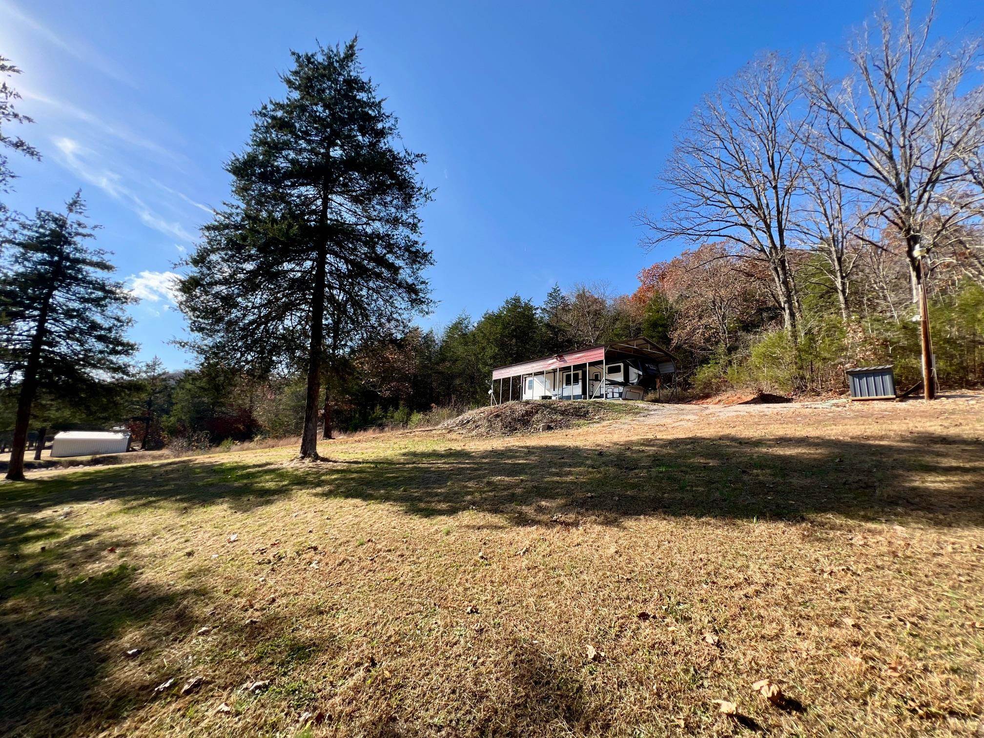 Versatile property located just down the road from Buford Beach. 8.83 acres m/l that consists of electric, well, septic, & RV Carport already on property. This is a wonderful recreational property not far from the famous Spring River. No restrictions. Camper does not convey with property.