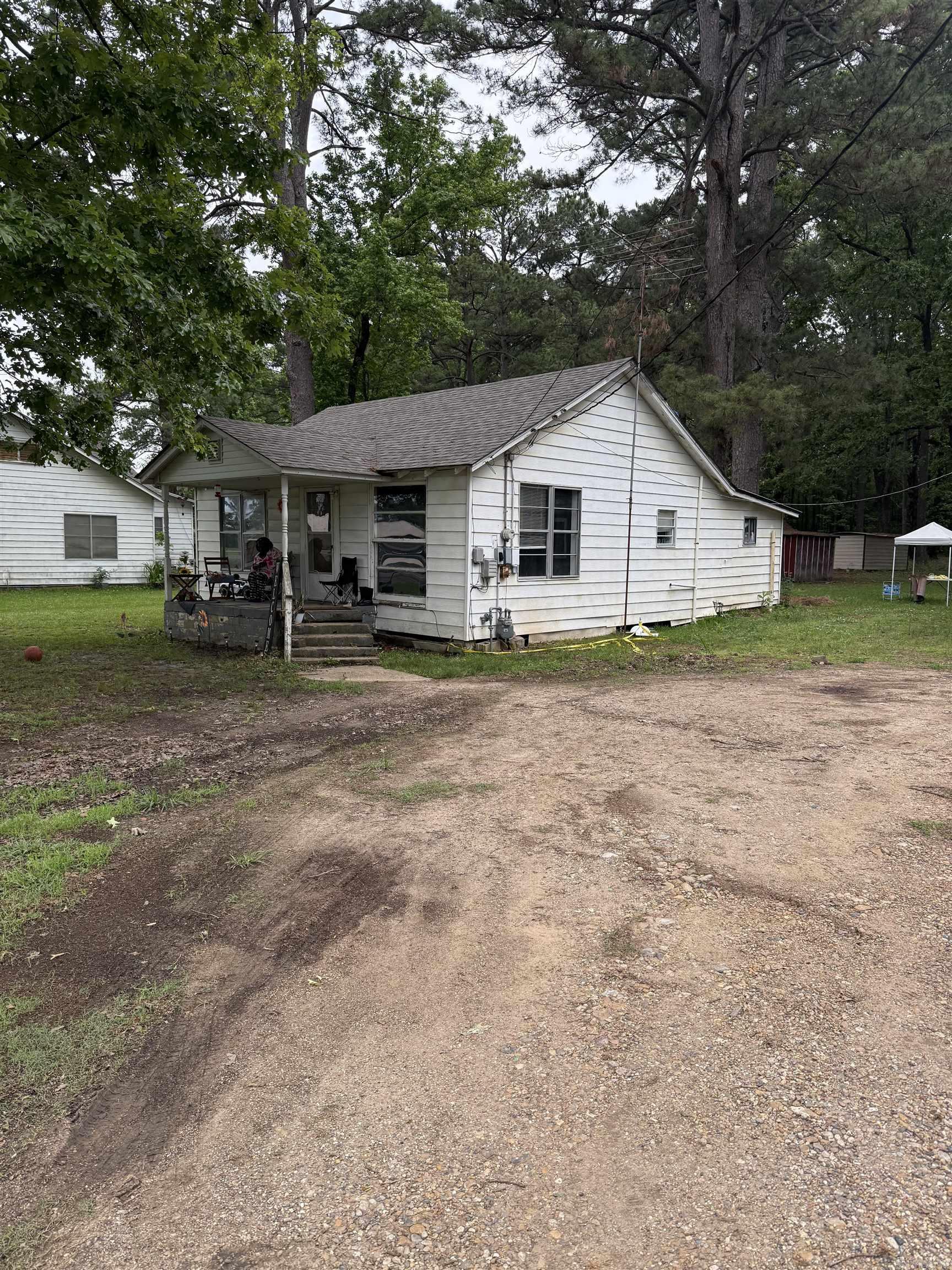 950 Sq ft 2bd 1 bath with bonus room that is being used as a bedroom. .75 acres lot with outbuildings, 2 car carport with storage room attached. house is being used as a rental and has tenants. Home is sold as is.