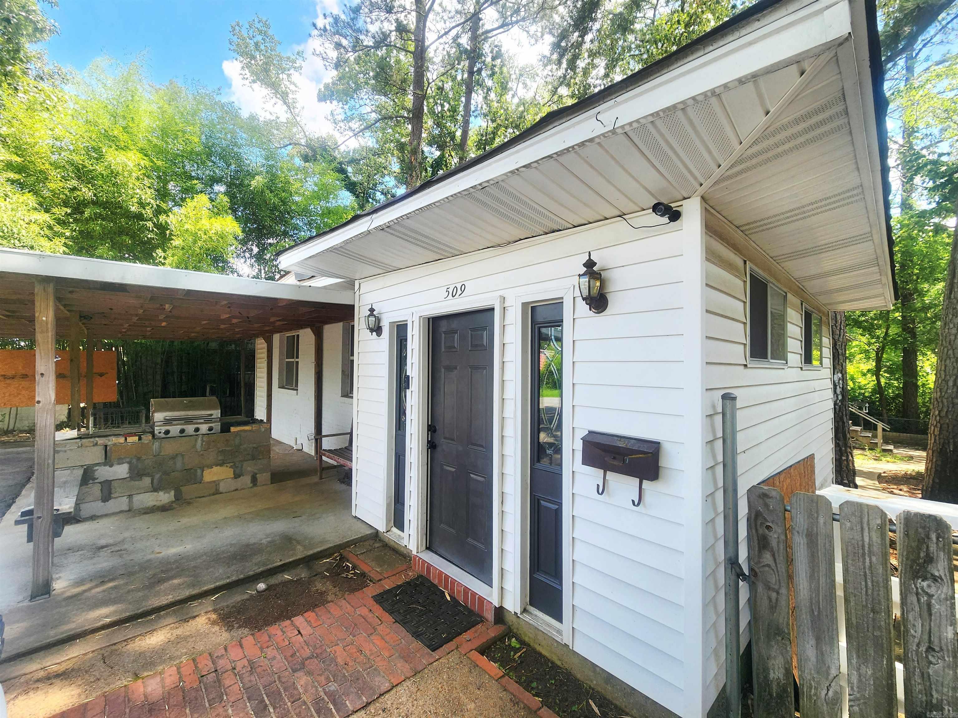 When you step into 509 Cherry Lane, you’ll immediately appreciate the blend of historic charm and modern updates. Original hardwood floors and stunning wood tray ceilings with shiplap accents create a warm, inviting atmosphere. The home offers two spacious bedrooms plus a versatile bonus space that could easily serve as a third bedroom, office, or flex room. A large screened porch off the primary bedroom provides the perfect place to relax, overlooking a low-maintenance backyard.