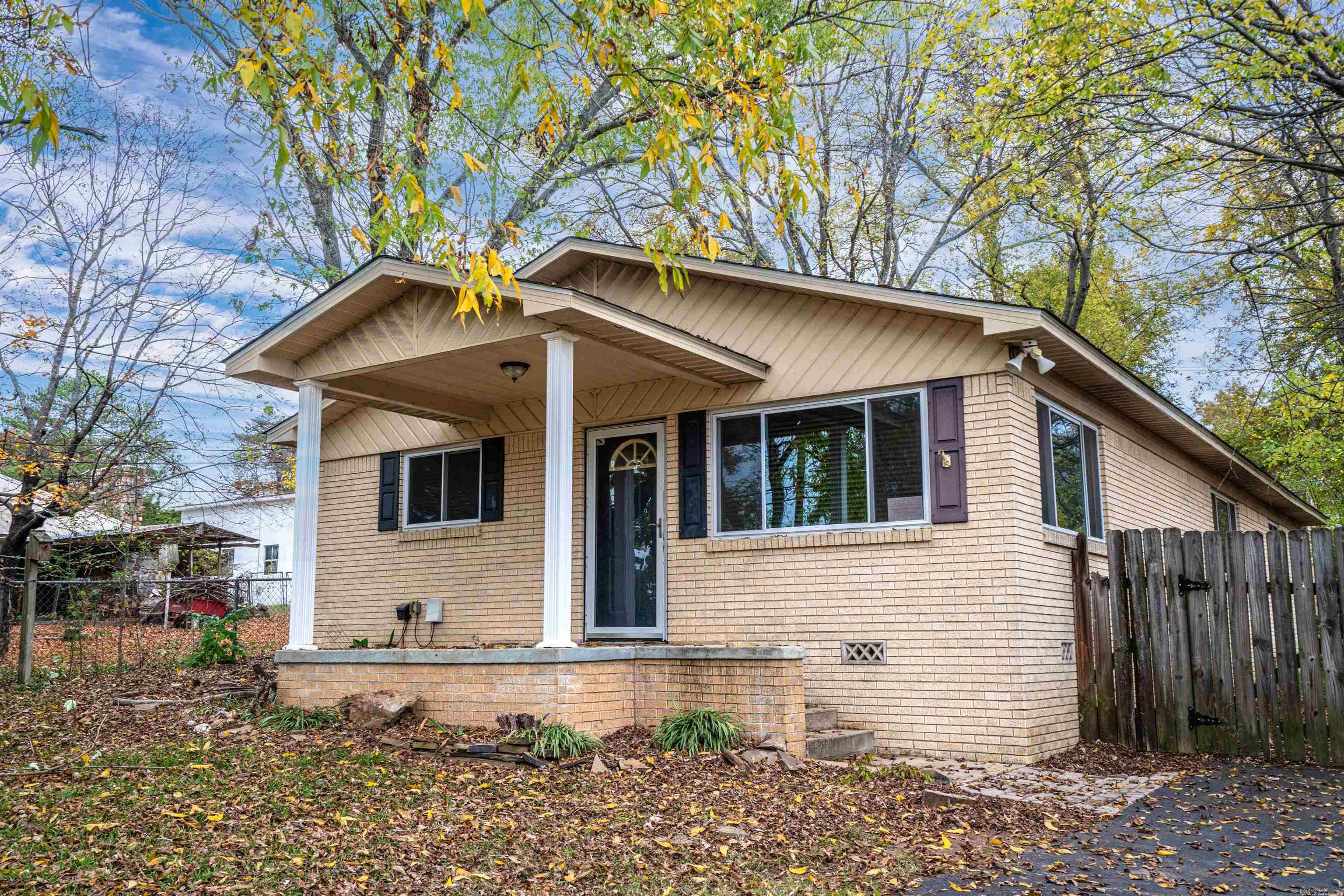 Minutes from Oaklawn, this 2 bd, 2b  brick home offers updates that will appeal to a  first home buyer, an investor for nightly rental or someone looking to be near hospitals and medical facilities.  The roof on the home as well as the HUGE storage building was replaced November 17th.  The updated bathrooms and new carpet in the master bedroom add to its value.  The home is freshly painted and has hardwood floors that appear to be the original.  Come see all this home has to offer.