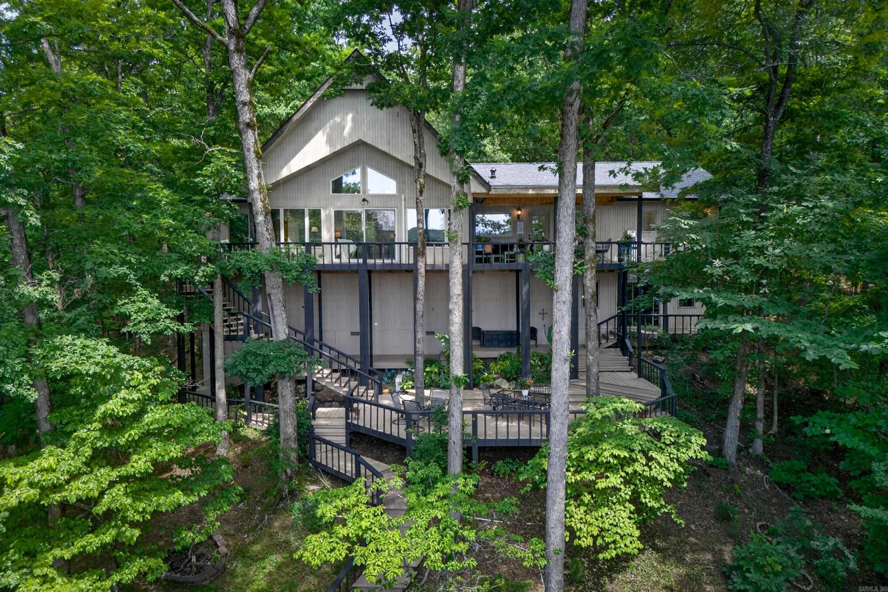 Welcome to your completely turnkey lakeside retreat on Lake Coronado! This stunning 3BR/2.5 home has been meticulously updated from top to bottom, offering the perfect blend of modern luxury and tranquil waterfront living. Step inside a bright, freshly painted interior (2025) enhanced by two new ceiling picture windows (2024) that flood the space with natural light. The heart of the home is the fully remodeled kitchen (2024), featuring gorgeous finishes, updated plumbing and hardware, and the addition of a large walk-in pantry. Upgraded light fixtures throughout add a modern, polished touch.  Outside, your personal lakefront oasis is designed for ultimate relaxation and entertaining. Enjoy panoramic water views from the extended upstairs deck, complete with a newly added patio roof and ceiling fan (2024) for comfortable year-round outdoor living. Down at the water, boating enthusiasts will love the refurbished covered boat dock, complete with a brand-new boat lift (2025).  With a new roof (2025) and a new HVAC system, all the heavy lifting has been done for you. Drop your bags, launch the boat, and start living the ultimate Lake Coronado lifestyle. SEE AGENT REMARKS.