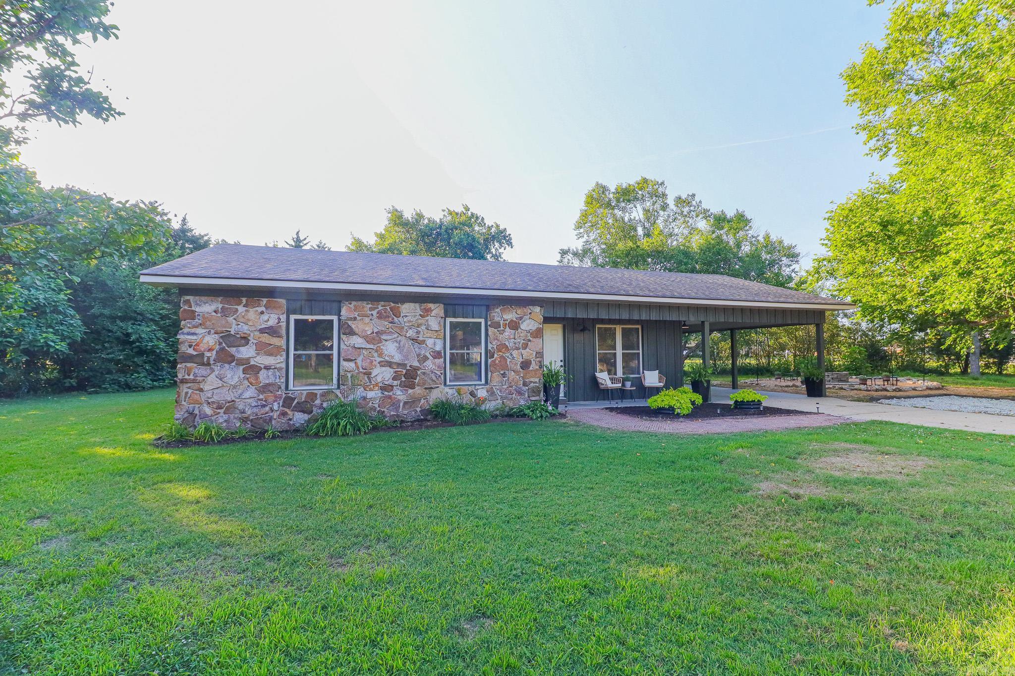 This remodeled Rector home blends rustic warmth with modern design on .42 acre lot in cul-de-sac. Designed for effortless entertaining, the interior features an open floor plan with new flooring, lighting and fresh paint throughout. The remodeled kitchen has new appliances, premium countertops and spacious pantry. A built in corner banquette offers cozy seating alongside integrated storage. Enjoy your spacious tree shaded side yard with a rock firepit, outdoor seating and solar lights for perfect outdoor entertaining. New central heat and air unit has been installed as well as a new hot water heater. Easy to show