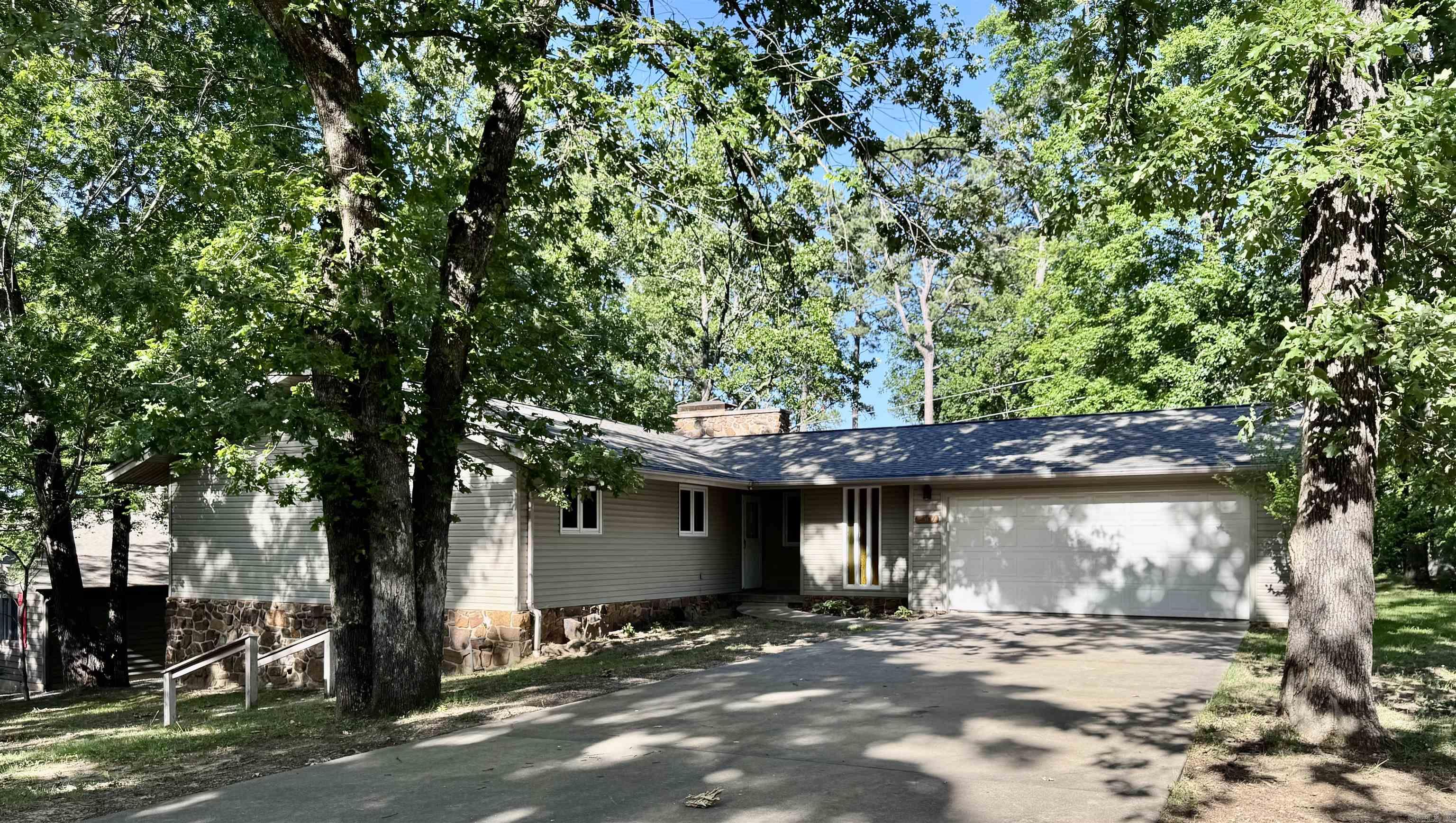 Wonderful 4BR/2BA home in a great neighborhood with a partial lake view, rock fire pit and mature trees! Features include a brand-new roof, newer hot water heater, spacious safe room, partial basement, and oak cabinets in the kitchen. Plenty of storage and space throughout. A must-see in a convenient location near the lake and a golf course! This property will not last long, call today for a showing!
