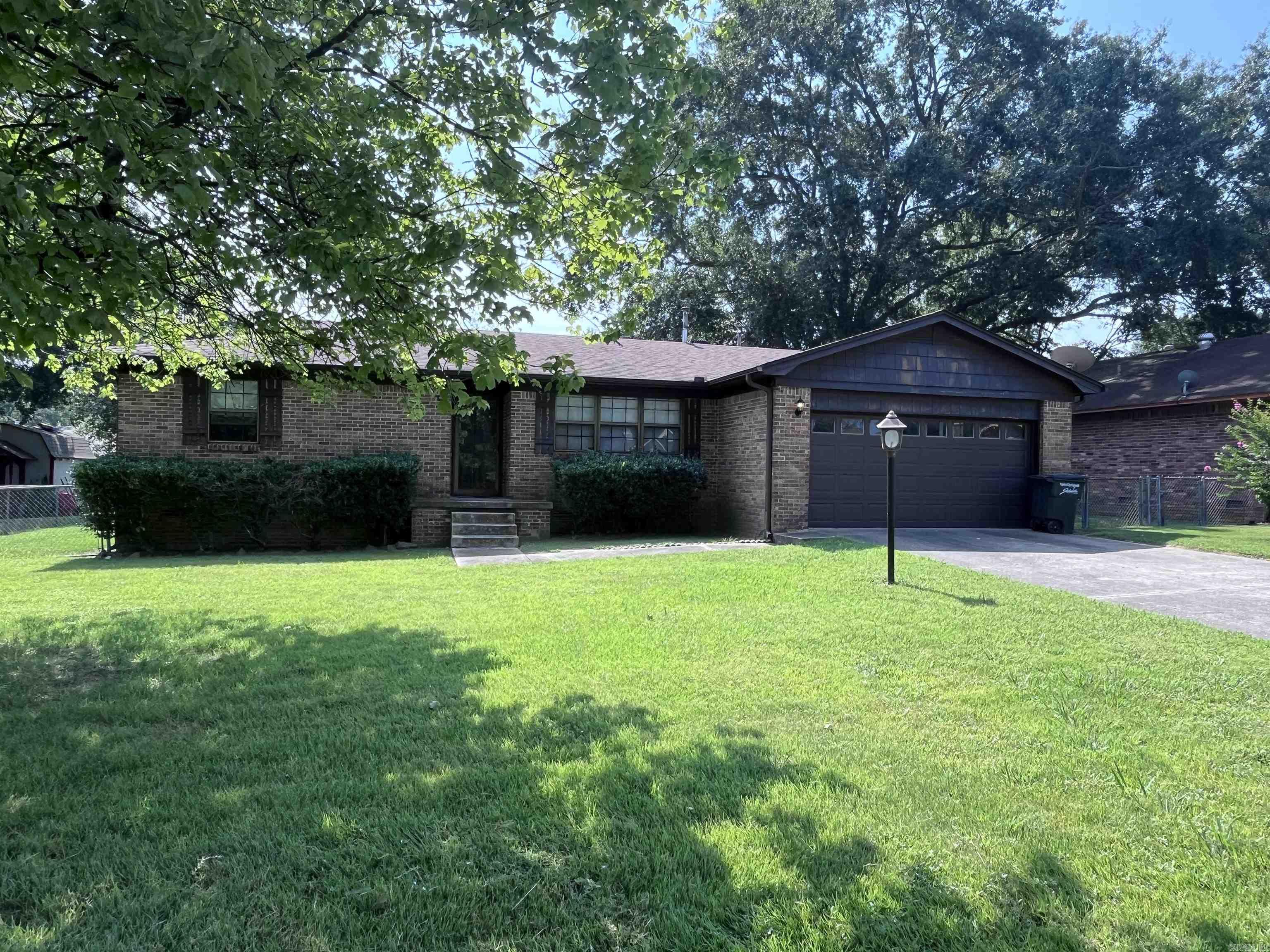 Spacious all brick 3 bedroom, 2 bathroom house in the Stonewall Subdivision. This house offers it all! Two living rooms, tons of windows for natural light, recently painted, tile and laminate flooring in common areas, separate laundry room, glass sliding doors leading to a concrete patio and HUGE backyard with fence and a storage shed, walking distance to neighborhood pool and park, two car garage and dog friendly. Only minutes from restaurants, shops, the interstate and Little Rock Air Force Base! Refrigerator included! This one will not last long!