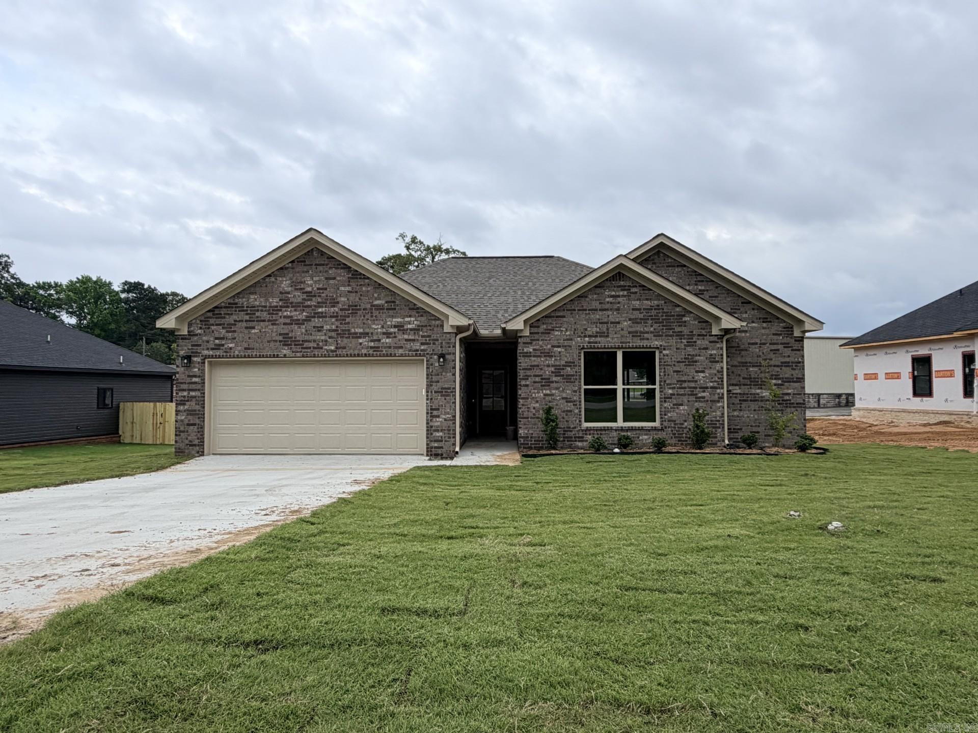 New construction home in the heart of White Hall nearing completion.  This 3-bedroom, 2-bathroom home includes luxury vinyl plank flooring, granite countertops and sleek stainless steel appliances.  Additional highlights include a large laundry room, fully sodded yard and stylish finishes throughout.  With modern amenities and a convenient location, this home offers a perfect blend of comfort and convenience.