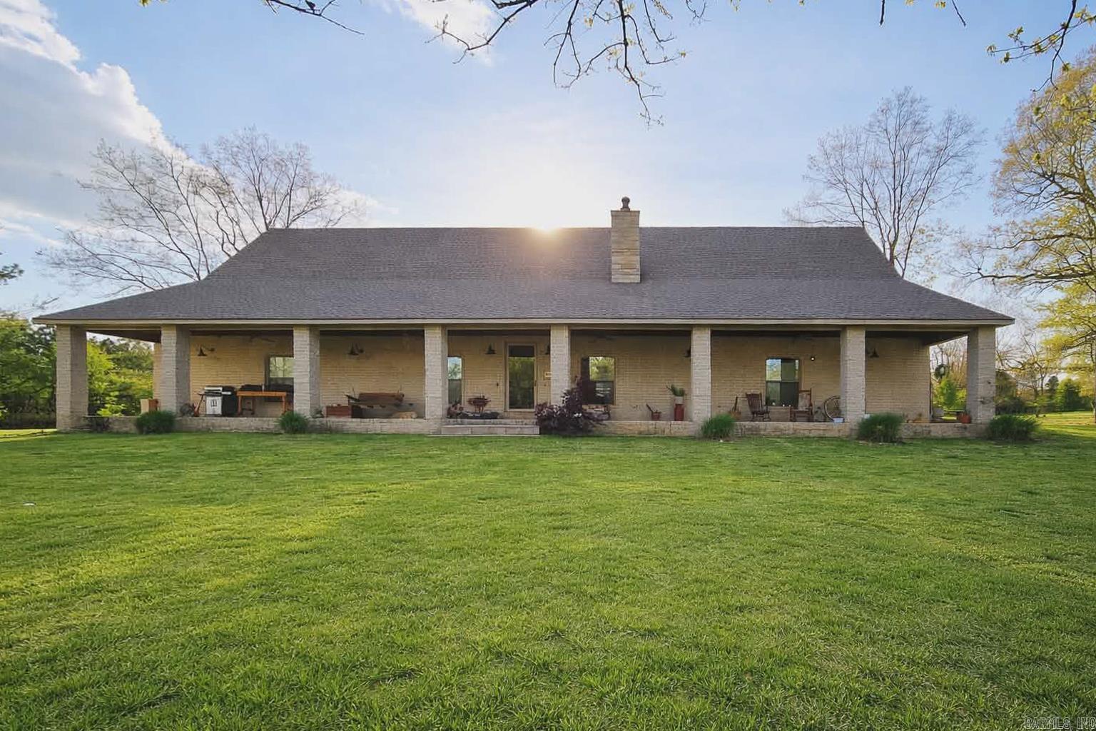 Welcome to peaceful country living with everyday convenience in the highly sought-after Brookland School District. This 4-bedroom, 2.5-bath home sits on 3.5 acres, with the option to expand to approximately 8.5 acres (see additional details below), offering space, privacy, and beautiful surroundings. A long private driveway leads to the home, where a large front porch overlooks a scenic pond—perfect for morning coffee or relaxing evenings.  Inside, you’ll find an inviting open floor plan with spacious living, dining, and kitchen areas designed for both comfort and entertaining. The kitchen offers ample cabinetry and counter space, flowing seamlessly into the main living area. The home also features an oversized garage with additional storage and a safe room for added peace of mind. Situated on a paved road, this property provides a quiet country setting while remaining just minutes from NEA Baptist, shopping, and dining. Offered at $649,900 with approximately 3.5 acres, or $817,500 with approximately 8.5 acres. Contact listing agent for details on acreage options. A rare opportunity to enjoy acreage, convenience, and a lifestyle centered around space and natural beauty.