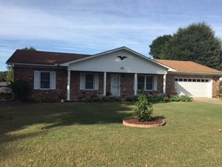 Well maintained all brick home in excellent location offers formal dining room, large living room with wood laminate flooring & brick fireplace with insert.  Kitchen has lots of cabinets, newer appliances & large breakfast area.  More energy efficient with all new windows, newer water heater & a/c unit.  Master bedroom has 2 closets, bathroom w/stand up shower. Outside you will find a covered patio and a 720 sq ft SHOP/2 car detached garage overlooking a huge fenced yard!!  Extra parking pads, too!