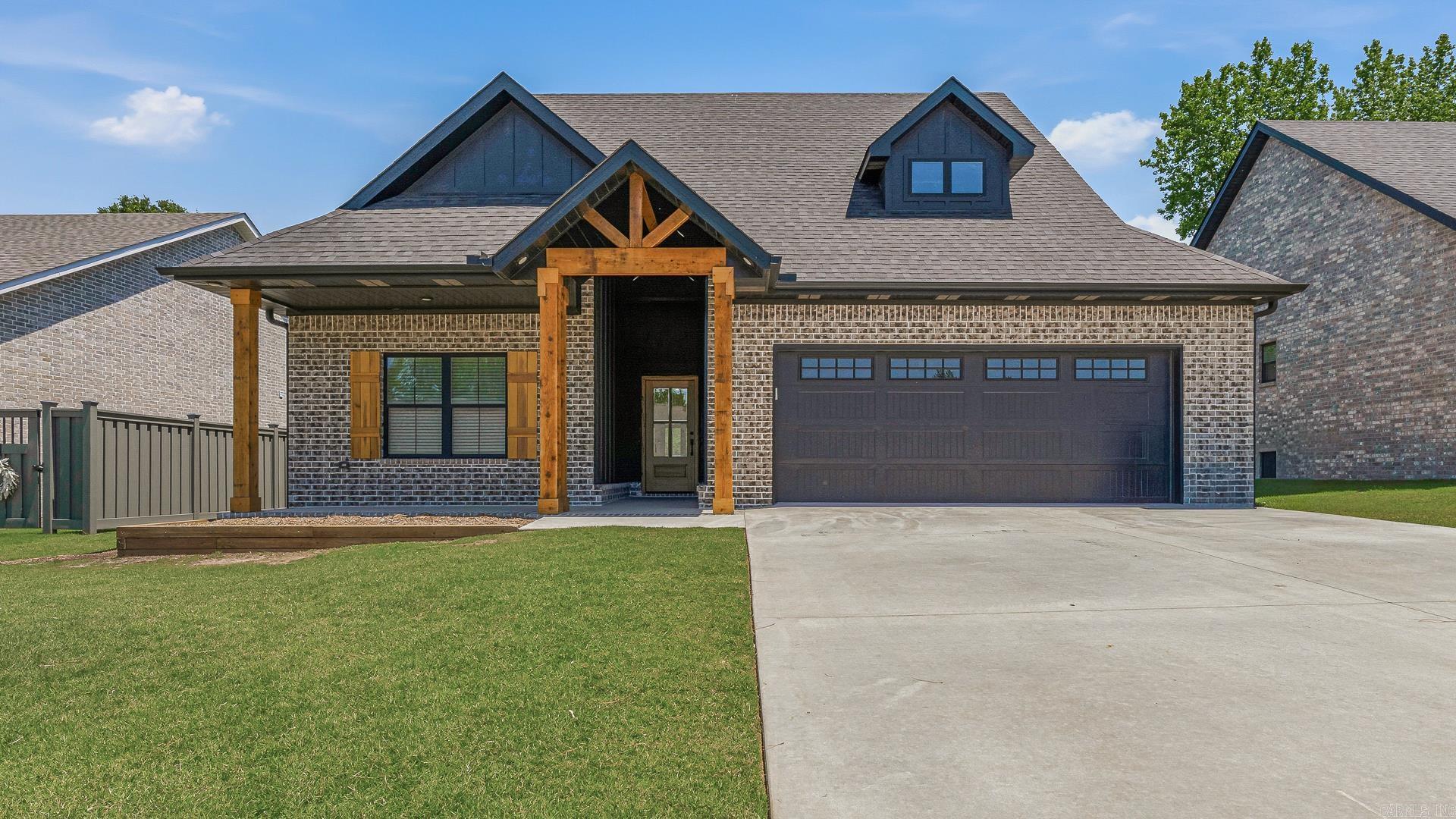 Built in 2024, this beautifully crafted home in The Farmhouses at Summit Ridge combines timeless design with modern comfort in one of Paragould’s most sought-after subdivisions. A grand entry welcomes you into bright, open living spaces accented by soaring 10-foot ceilings throughout the main areas and primary suite, creating an airy and inviting atmosphere. The open-concept layout is designed for effortless living and entertaining, connecting the spacious living room, dining area, and chef-inspired kitchen. Featuring an oversized island, upscale finishes, and generous storage, the kitchen serves as the heart of the home. The luxurious primary suite offers a relaxing escape with a spa-like bath complete with a large tiled shower, separate soaking tub, and an oversized walk-in closet with direct access to the laundry room for everyday convenience. Thoughtfully designed with style and functionality throughout, this home offers the perfect blend of modern luxury and practical living.