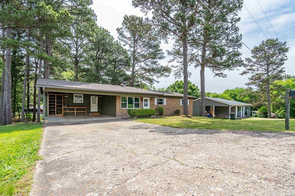 This spacious 3-bedroom home has been revitalized with brand-new flooring and fresh paint throughout, creating a bright and airy atmosphere that is ready for immediate move-in.  The heart of the home features a functional layout designed for comfort with a spacious living area. From the large kitchen and dining space, step out onto the deck—the perfect spot for morning coffee or summer BBQs while overlooking your large backyard. The primary bedroom is complete with its own bathroom. Two additional bedrooms on the main level offer plenty of natural light and easy access to the main living areas. The lower level features two bonus rooms, ideal for a home office, guest quarters, or fitness area with a convenient half-bathroom and access to the backyard.