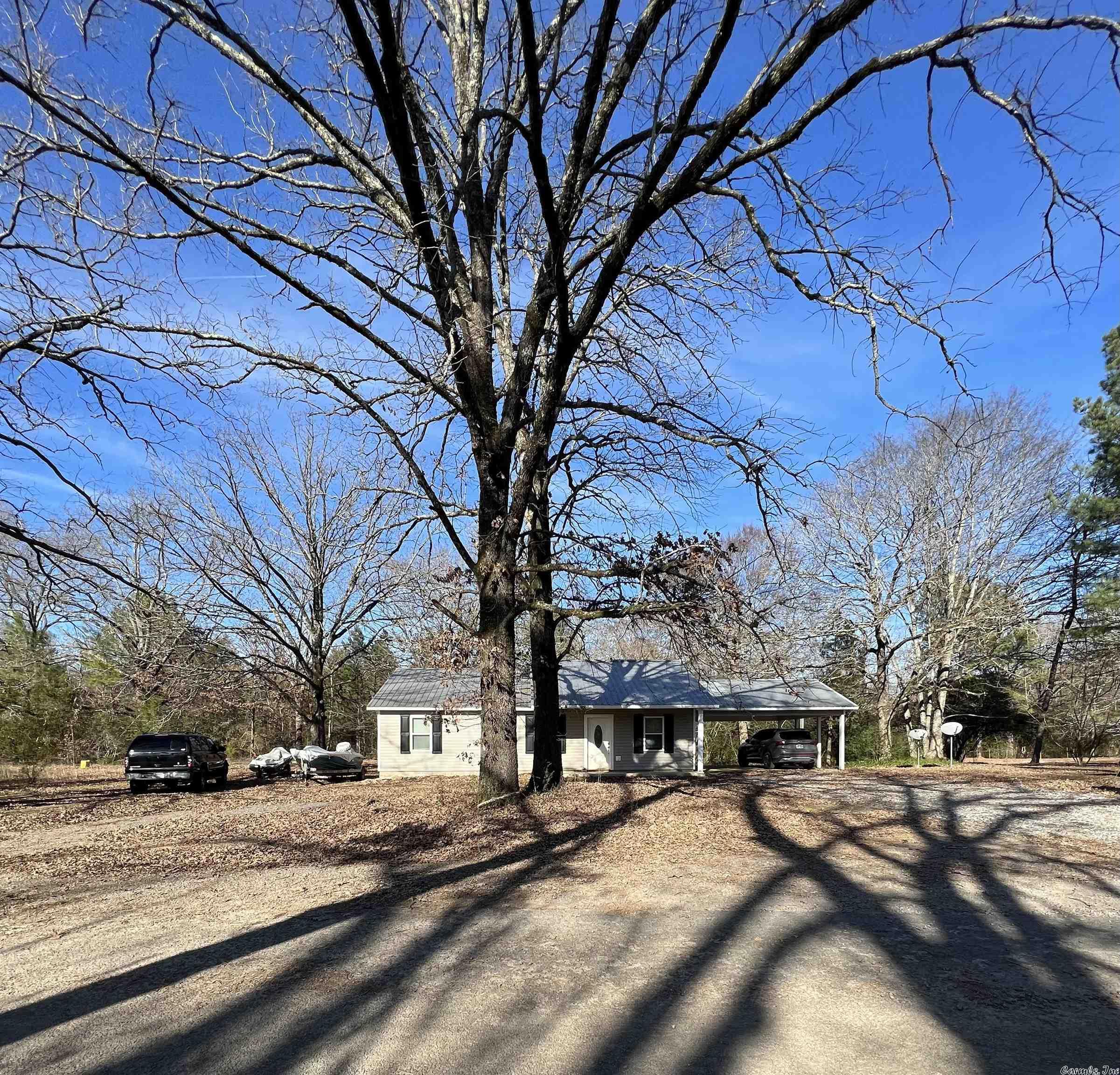 Rural setting that is close to Conway and all the amenities. 3BR/2BA home with a 2 car carport and storage shed on almost 1/2 acre.  Laundry room with washer and dryer that convey.  Eat in Kitchen with refrigerator, dishwasher and freestanding range.  Come see today.