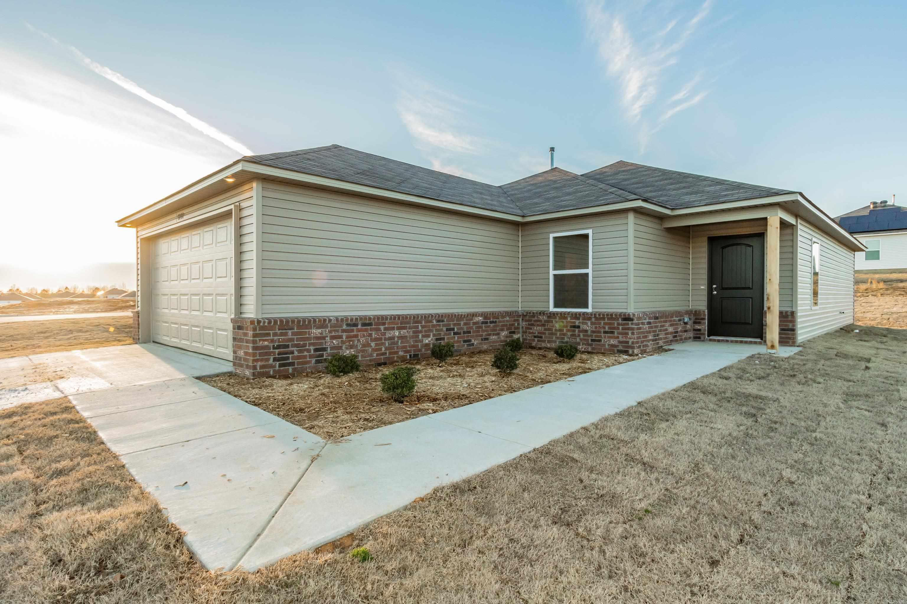 Come explore the Armstrong II plan! Bedrooms 2 & 3 are steps away from their shared Bathroom - and from the Laundry - for ultimate convenience. The Master Bedroom is set to the rear of the home for added privacy. This home is located on a corner lot!   Upgrades included by design: soaker tub/shower combo in Master Bath, plumbing faucet upgrade 2, gas furnace upgrade, door bell, flush laminate bar upgrade, Luxury Vinyl Plank flooring in wet areas and Living Room and adjacent hallways, raised ceilings in Living Rooms per municipal requirements, Cheyenne style interior doors, baseboards level 2, LED disk lights in Kitchen, ceiling fan level 1 in Living Room, full sod, microwave hood in Kitchen, smooth top range.   THIS HOME IS SCHEDULED TO BE COMPLETE IN LATE DECEMBER.