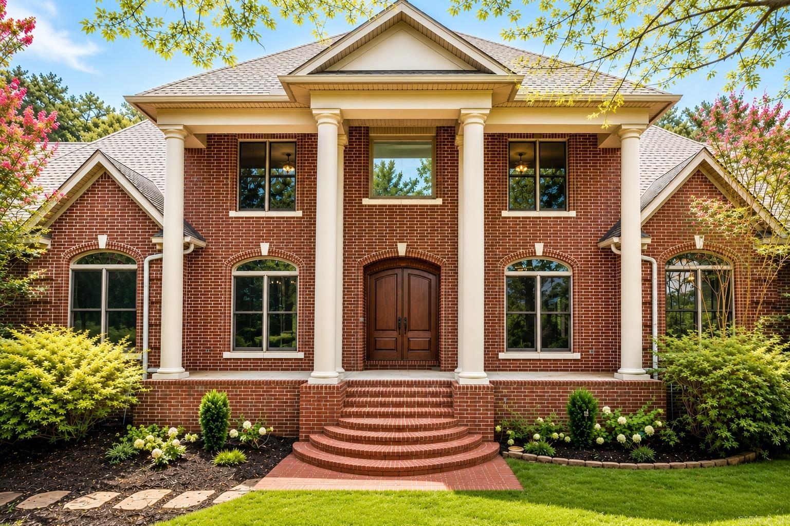 Set on nearly two private acres in the prestigious Margeaux neighborhood of Chenal Valley, this exceptional residence has been thoughtfully reimagined with sophisticated finishes and timeless design. Every detail has been elevated with new flooring, designer lighting, beautifully renovated baths, and custom cabinetry throughout. The chef's kitchen is truly the heart of the home, showcasing an impressive 8-burner gas range, pot filler, ice maker, butler's pantry, and abundant workspace for entertaining. The main level offers a luxurious primary suite, two additional en suites, and a private office. Upstairs features two bedrooms, two full baths, an expansive media room, bonus room or sixth bedroom, kitchenette, and private access to the oversized garage—creating the perfect space for multi-generational living, guests, or an au pair suite. Tremendous storage throughout, with each bedroom having its own walk-in closet. A rare combination of privacy, luxury, and versatility, just moments from the premier amenities of Chenal Valley.