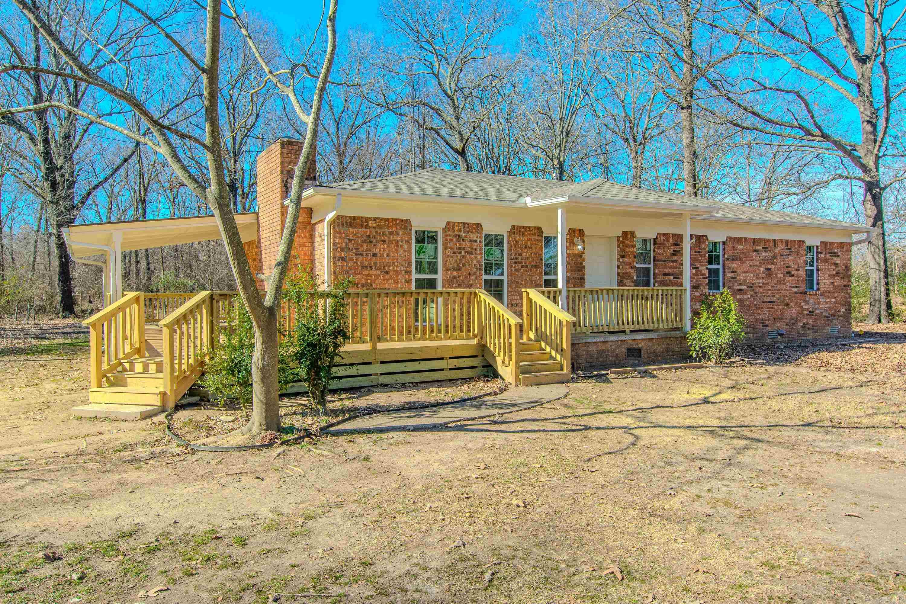 Charming country home on acreage with a welcoming wraparound porch! This 1,400 sq ft 3BR/ 2BA home offers peaceful living with modern updates, including a new roof, new windows, new AC, and new furnace. Inside features include can lighting, an eat-in kitchen with a gas stove, a large laundry room, a dishwasher, and gas hot water tank. The living space is anchored by an electric fireplace, perfect for adding character and warmth. Outside includes a shop with electricity—perfect for hobbies or storage. Septic system in place, and an active termite contract with Adams. Enjoy the comfort, space, and quiet of true country living. New, New, New!! without the hefty price tag. An amazing place to slow down, settle in, and make lasting memories. Let's schedule your showing today