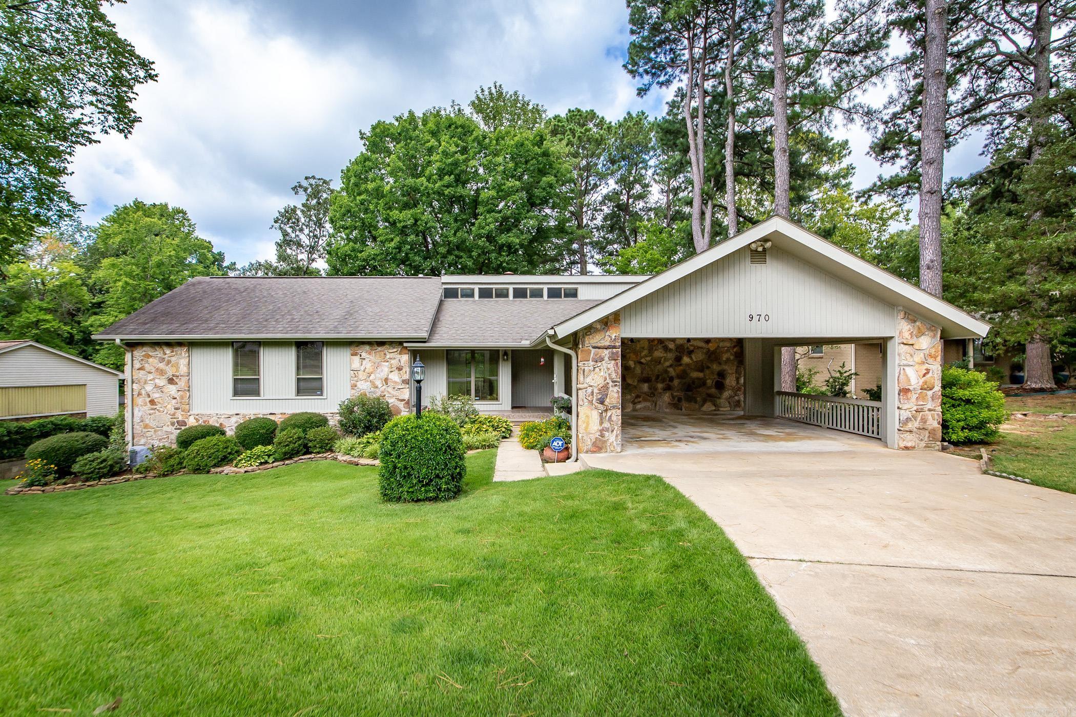 Greers Ferry Lake is literally a stones throw away from this property.  Walk to the lake and. cool off.  The water is clear and refreshing. A great, well maintained, loved home with plenty of room and decks for entertaining family and friends. Primary bedroom has office/baby's room.  Kitchen offers a butlers pantry.  Exterior of home was recently painted. Home offers a shop/safe room/man cave under the house.  This is one of the nicest neighborhoods and it's conveniently located to all amenities. New roof November 2025, new heating and air November 2025.  Pictures with furniture are AI generated.