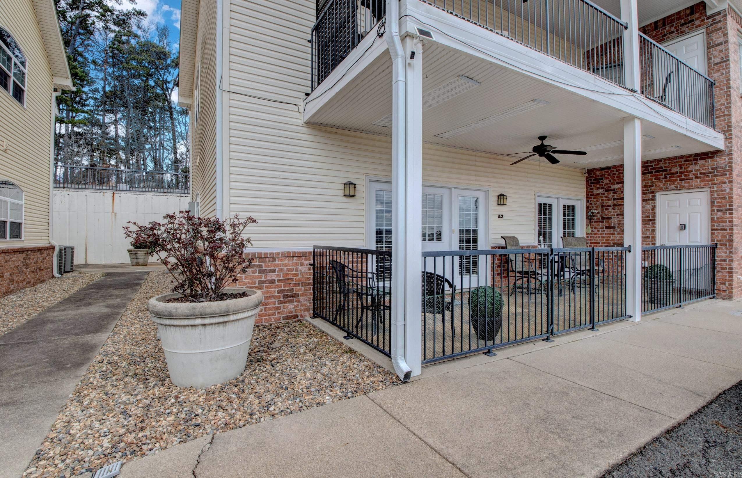 Welcome to this beautifully maintained 2-bedroom, 2-bath condo in the highly desirable Lake Hamilton area of Hot Springs. This spacious unit offers approximately 1,400 sq. ft. of comfortable living space with a functional layout ideal for a primary residence or a vacation getaway. Enjoy walk-in level access for easy entry. The inviting living area features a cozy fireplace and open living/dining concept, perfect for relaxing or entertaining. The kitchen offers ample cabinet and counter space, while the primary suite includes a spa-style bath and generous closet space. Step through French doors to a private covered patio where you can enjoy peaceful views of Lake Hamilton and the surrounding mountains. Residents of Peters Point enjoy amenities including a community pool and lake access with boat tie-ups. Conveniently located just minutes from Central Avenue, Oaklawn Racing Casino Resort, shopping, dining, and entertainment, this condo offers the perfect blend of lake living and city convenience. Whether you're looking for a primary residence or a weekend retreat, this Lake Hamilton condo is a fantastic opportunity to enjoy the best of Hot Springs living.  Come see!