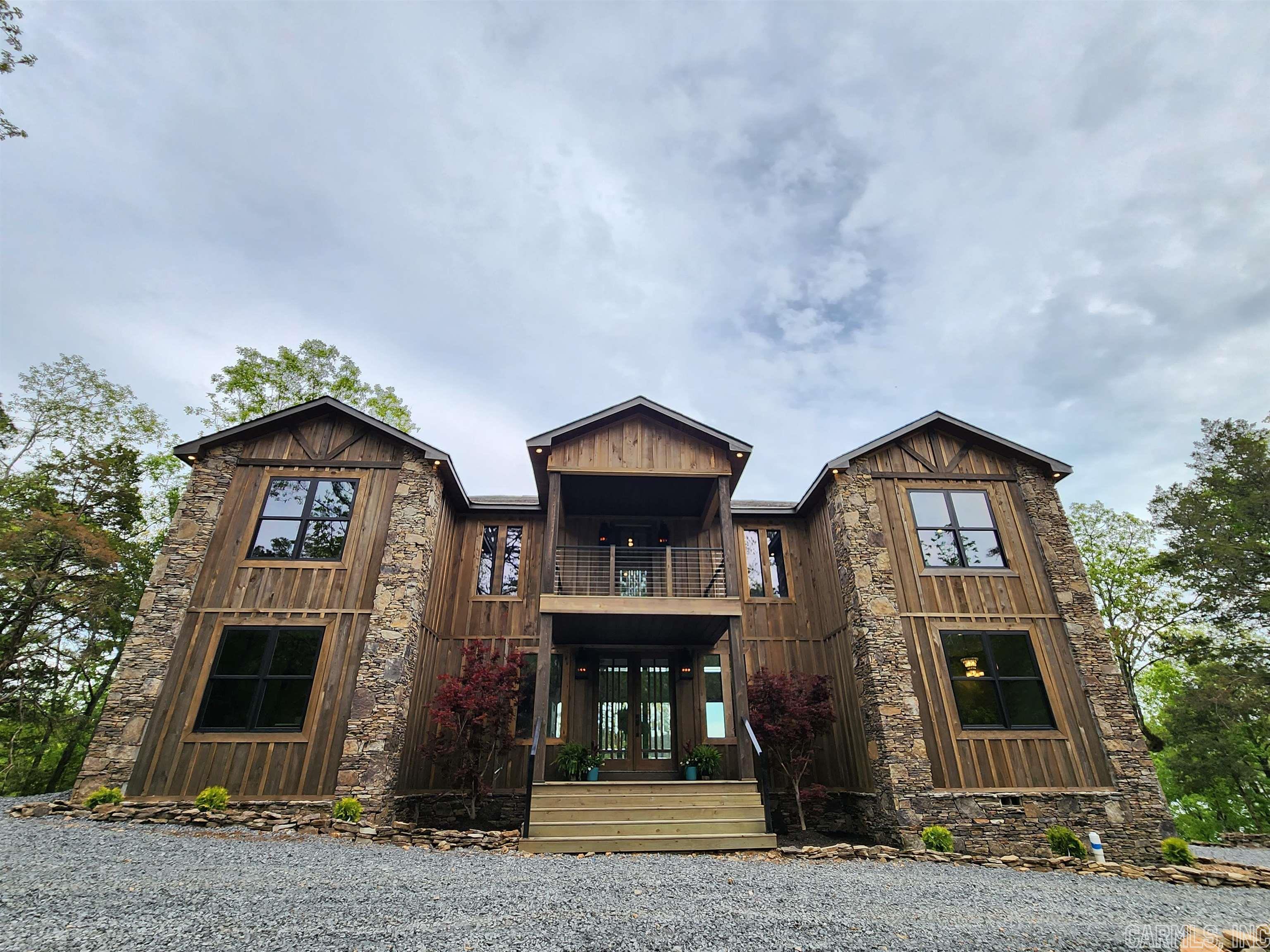 New LakeFront, New Construction, & Boat Slip all offered with this SHEER LUXURY, Custom built 4 bed/3.5 bath Lakefront home on  Greers Ferry Lake with 220ff of Lakefront! This 2 story homes offers large custom kitchen, deep farm house sink, Anderson style windows, 10" wide real wood floor covers all the home floor with tile in bathrooms & laundry room, Golden Chandler decorates these 22 ft ceilings over the main living area, 3  Walk in showers,  large soaking tub, walk In custom closets and more!  Master bed & bath on main floor with 3 Pella style walk outs to the main floor covered deck, while the 2nd floors offers 3 bed & 2 bath & 2 more Pella style walk outs to the top deck. From here enjoy panoramic views of the lake! Modern steel railings offer you a clear view no matter where your at in the home!  This custom homes Floorplan will guarantee to bring the WOW factor Your are looking for in your Lake Front Home!  Homes final items are being wrapped up as we speak. Nightly rentals are allowed here too! Looking to the next 3 weeks before we begin showings or tours. Tannenbaum Golf Course sits a short walk from this amazing timeless lakefront home! More pics & video to come 3 weeks