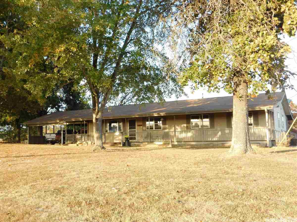 Rural Privacy...Just off pavement find this comfortable country home with 3 bdrms & 2 baths. Large front & back porches, low maintenance siding, a 2 1/2 car carport plus detached shop/garage with scenic views & a variety of trees. Have your morning coffee while enjoying the sunrise from the screened in back porch, then watch the sunset in the evening from the extra wide front porch. Canoeing and trout fishing available just a couple miles away in the beautiful Spring River. DSL & Cell Phone friendly.