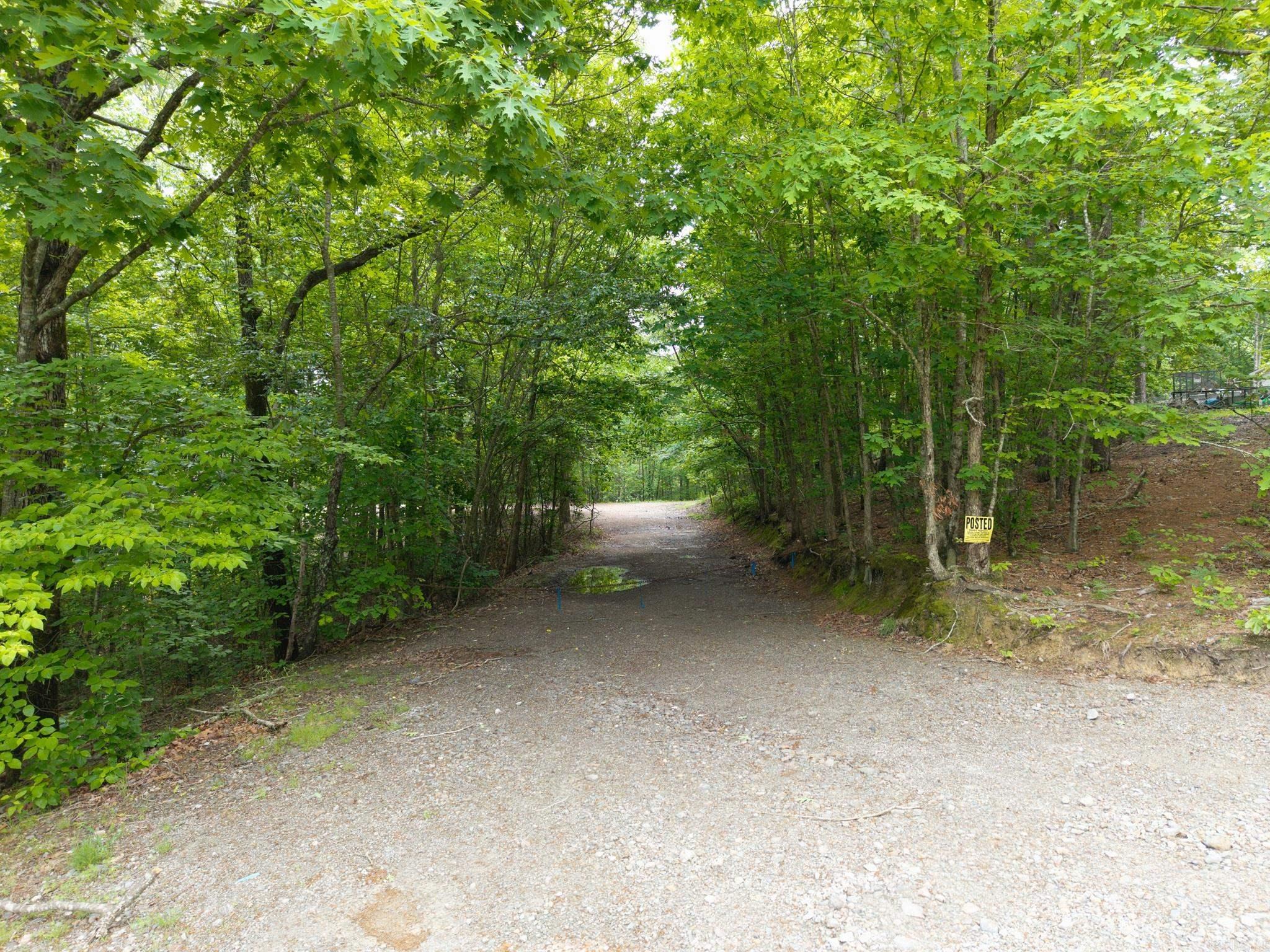 If you're searching for acreage near Hot Springs with no restrictions, this property deserves a look. This 10-acre wooded property offers privacy, space, and flexibility just outside the city. The land is mostly wooded with a cleared area already suitable for a home, cabin, or mobile home, making it a great option for buyers wanting to build or set up a private getaway.  The property previously had a mobile home in place, which has since been removed—leaving behind an established homesite and demonstrating the property’s readiness for future development. In addition, the acreage offers multiple potential build sites, giving buyers the ability to choose their ideal setting or explore options for future division.  Located in the Fountain Lake School District, the property is just minutes from Hot Springs Village and roughly 20 minutes from downtown Hot Springs, giving you convenient access to shopping, dining, Oaklawn, and local attractions. The property is also convenient to both Lake Ouachita and Lake Hamilton, making it easy to spend a day on the water without traveling far from home.