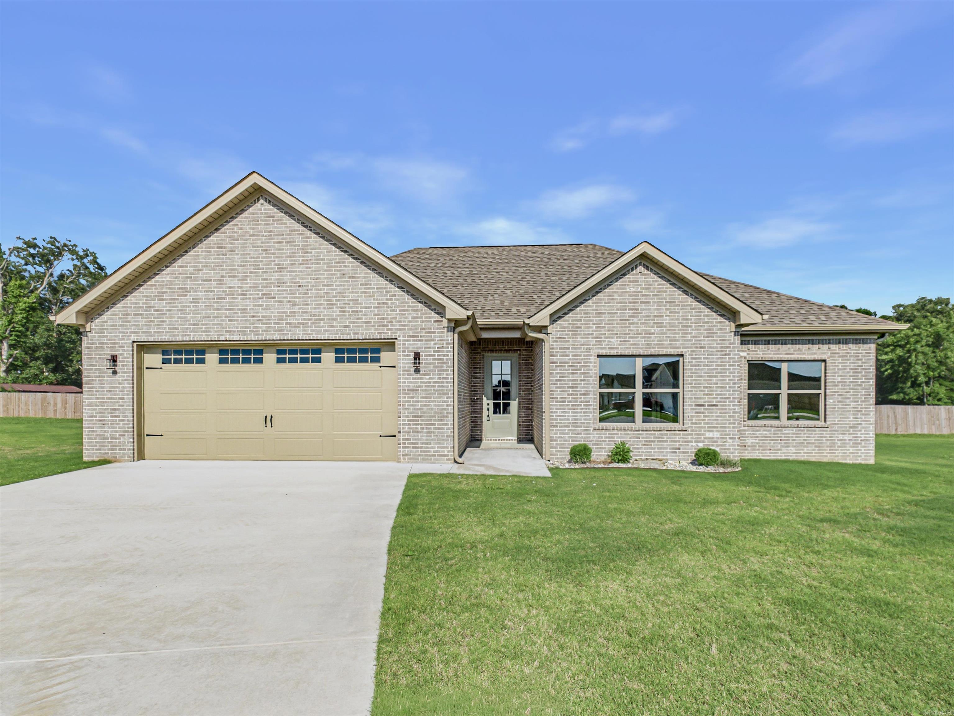 This NEW CONSTRUCTION and ALL BRICK beautifully appointed 3 bed, 2 bath home blends style and comfort with an open layout. Tall ceilings, beautiful trim work lvp throughout and a STUNNING statement fireplace wall. The kitchen shines with quartz countertops, pantry, ss appliances and modern appeal, The primary bath includes a gorgeous tile shower, vessel tub and so much more. Enjoy mornings on the back porch and evenings in the large backyard—perfect for making memories. This is a must see. ** See remarks**