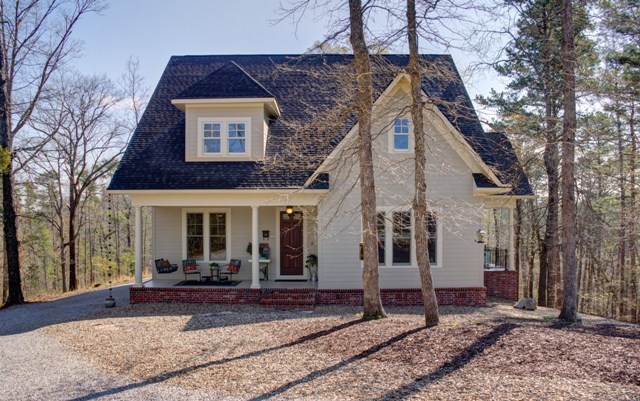 Your very own hide away nestled among the trees on top of the mountain. This beautiful home is bright, open and clean as a whistle with custom cabinetry, granite counters and hardwoods throughout. Take in the sounds of nature from either of the 2 porches or relax in the claw foot tub in the master bath. Plenty of storage, 2 car garage and a large workshop make this home a must see.