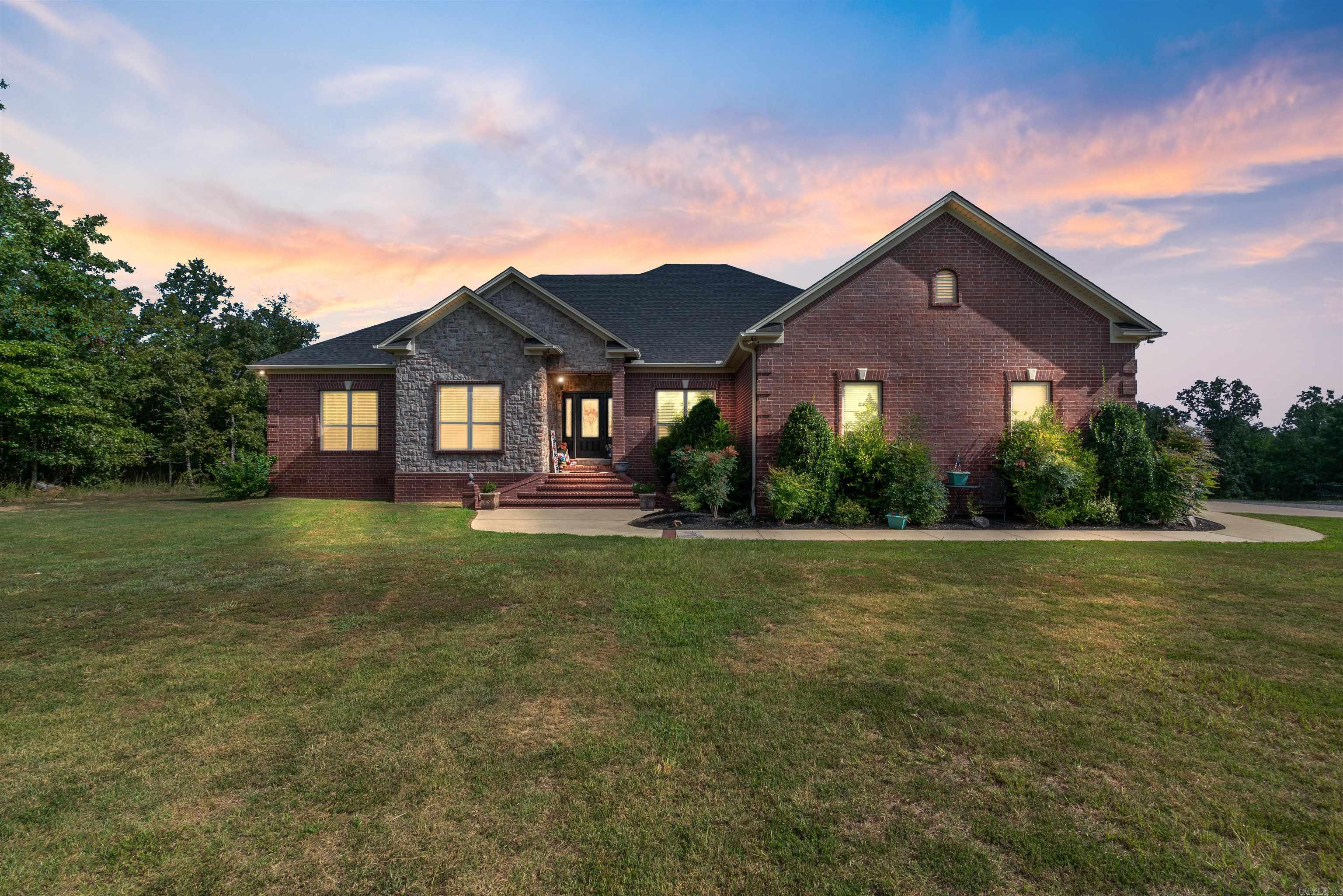 Discover the life of luxury & relaxation in this expansive estate nestled on 5ac of picturesque beauty. Grandeur & comfort on a ridge of panoramic views that will take your breath away. Int offers gourmet kitchen w Alderwood cust cabinets & slow close drawers & doors throughout. Granite counters, SS appl, commercial refrig, farmhouse sink & more! 5BR!.  Baths have poured Marble. Every room has a view! Very lg safe room downstairs w a smaller safe inside-FEMA app. Relax on the massive covered back porch and count the hummingbirds! HVAC  is geothermal w 3 zones-what an upgrade!  Shop is an expansive 50x60 & is a haven for hobbyists & tinkerers alike. Whether youre a woodworker or simply need extra space this is the perfect place!  Above the shop there is a private in-law quarters w appr 1300 SF- 2BR/1.5 Ba w small office, also has silestone counters. Shop has 220V for camper hook up w sm sewage hook up as well. Roof/gutters new in 2022. With its harmonious blend of sophistication & beauty this home is more than a home-it's a lifestyle of paradise & country escape. Many more upgrades than listed - agents see remarks & attached amenity sheet