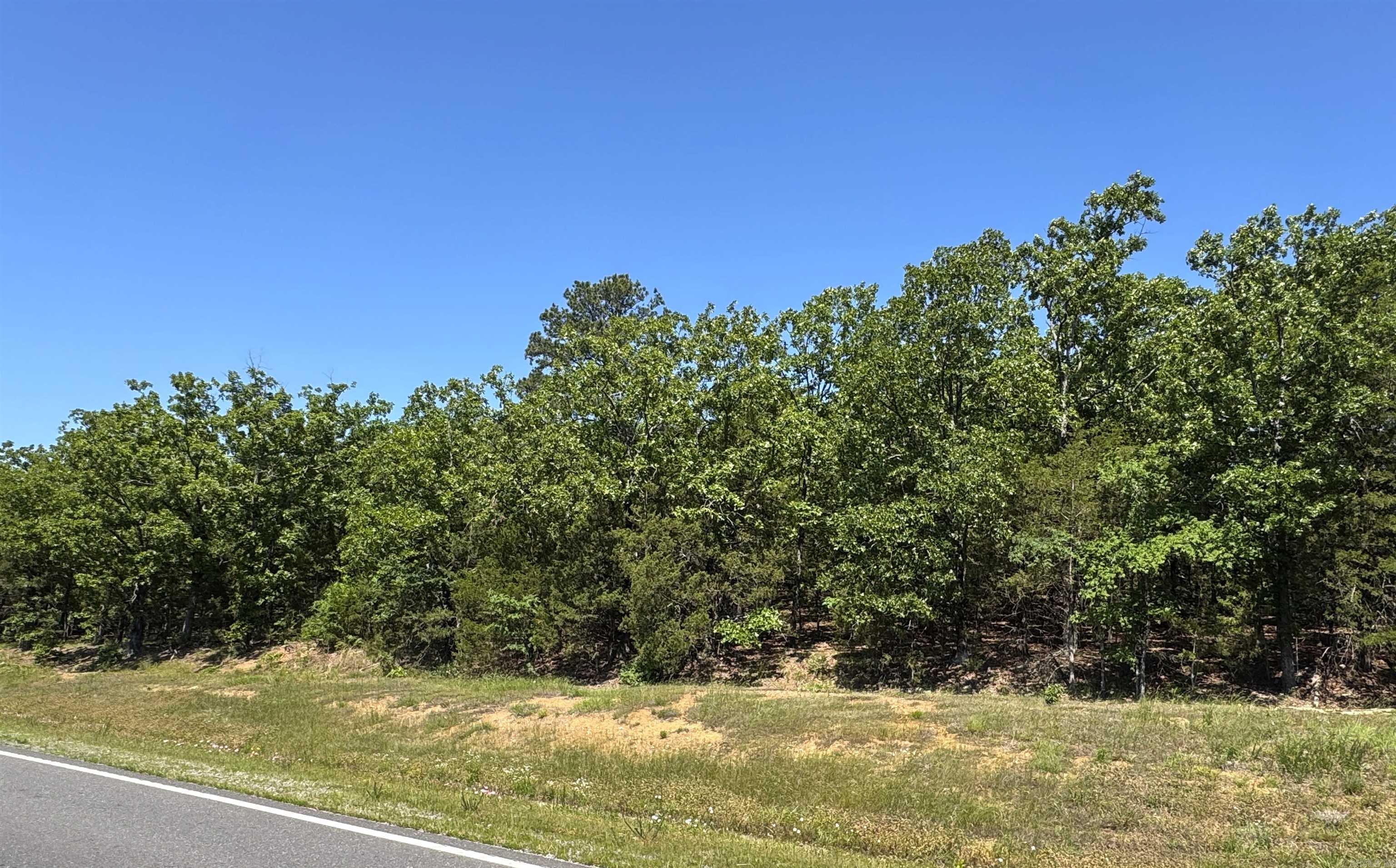 Excellent opportunity to own 1.26 acres, ideally located just off Highway 9 and only minutes from I-40, offering both convenience and accessibility. This property features highway frontage for visibility and easy access, along with a more private rear setting accessible from Kordsmeier Lane, perfect for building your future home or securing a smart investment. Enjoy the convenience of nearby shopping and dining while maintaining a quiet, country setting. With utilities available and a completed perc test, this property is ready for development and offers a strong balance of privacy, location, and potential. Property Highlights: • 1.26 acres with flexible residential or investment potential  • Prime location just off Highway 9 and minutes to I-40  • Highway frontage for visibility and convenient access  • Secondary access from Kordsmeier Lane for added privacy  • Nearby shopping and restaurants for everyday convenience  • Peaceful, country setting while still close to town  • Utilities available, helping reduce development costs  • Completed perc test, adding readiness for construction  • Great combination of accessibility, privacy, and future potential Schedule your showing today.