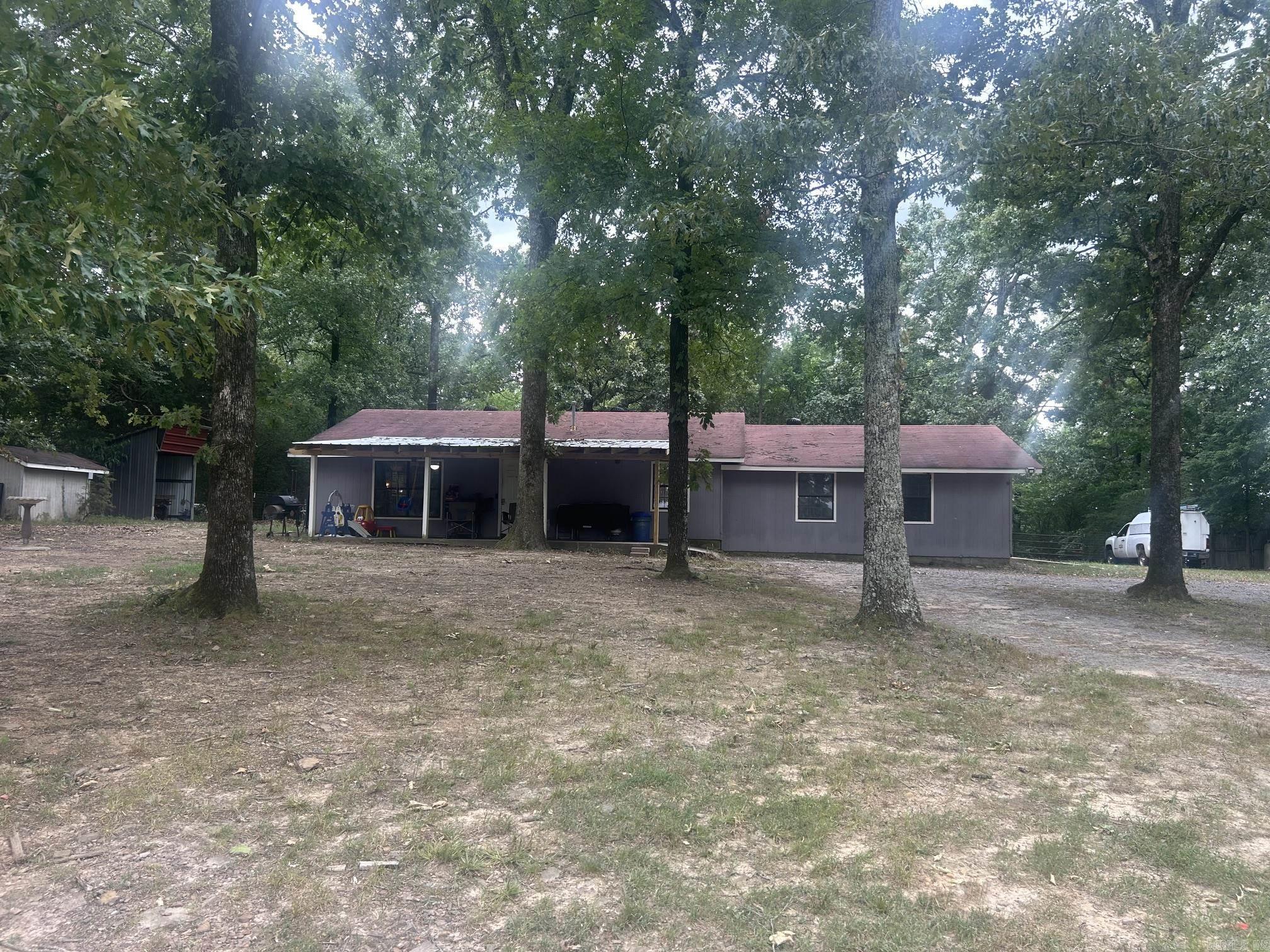 Three Bedroom Home with Two Car Garage located on 3.10 acres in Greenbrier School District. Overlooks a nice pasture.  House has stained concrete floors and new Air Conditioning.