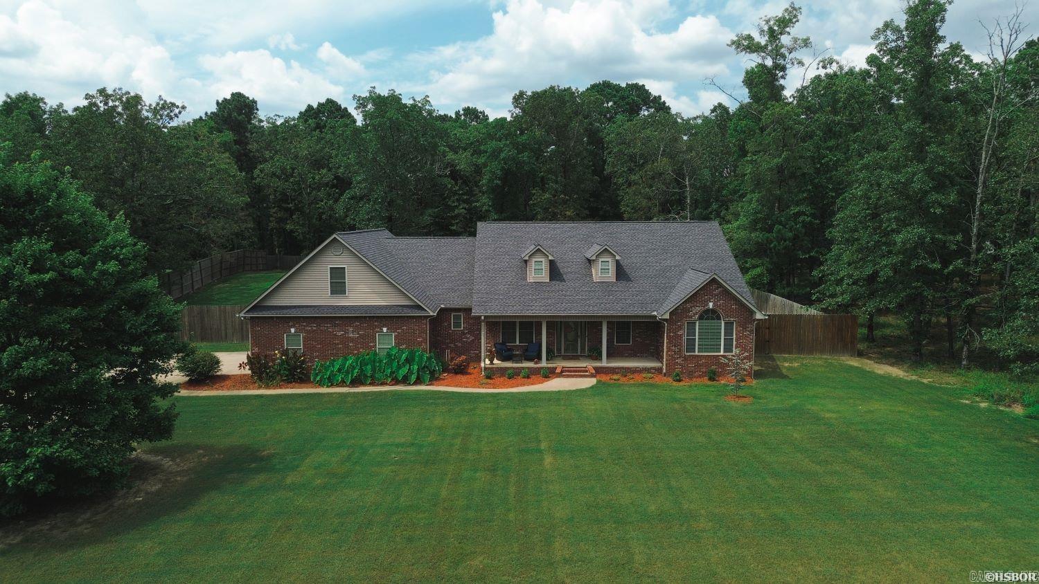 Welcome Home!! Rest Easy in this 3 bedroom 2.5 bath spacious home with 2 Very Large Bonus Rooms and an Office sitting on almost 2 acres within walking Distance to Lake Hamilton School. All 3 bedrooms and office are on the main level, 2 large bonus room on 2ndfloor. New Roof 2021, Downstairs HVAC New 2021, Upstairs 2020, New Septic Pump 2024. New Hardwoods in Living Room, Dining and Office 2021. New Carpet in Bedrooms 2024. Fenced back yard and almost 1 acre track adjacent still wooded. Inside photos to come soon