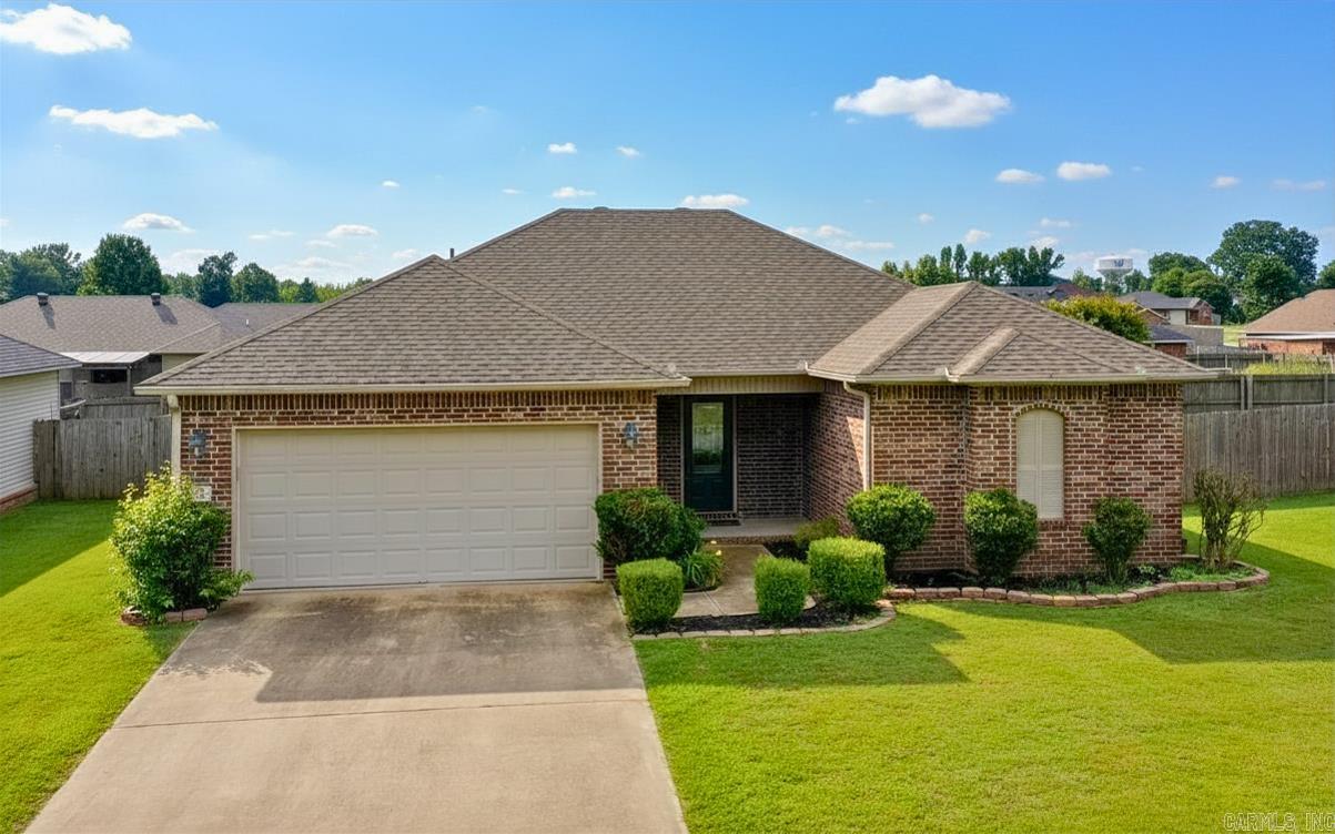 Qualifies for $0 USDA financing for qualified buyers, which means you might be closer to homeownership than you think. This 3 bedroom, 2 bathroom home sits on a quiet street just moments from I57 and area schools, making everyday life a whole lot easier. From the moment you pull up, the welcoming front porch gives you that “sit a while” feeling, and inside, the fresh paint keeps everything light, clean, and move in ready. The layout just makes sense, with a split floorplan that gives the primary suite its own space, complete with dual sinks, separate closets, and a private water closet, because sometimes you just need your own moment. The additional bedrooms are tucked away on the opposite side and both offer generous walk in closets, so no one is fighting over storage. The spare bathroom is spacious, the laundry room is right where you need it, and the fully fenced backyard is ready for pets, play, or peaceful evenings.The roof was replaced in 2023, so one more big thing is already handled. This one is equal parts practical, comfortable, and just feels like home.