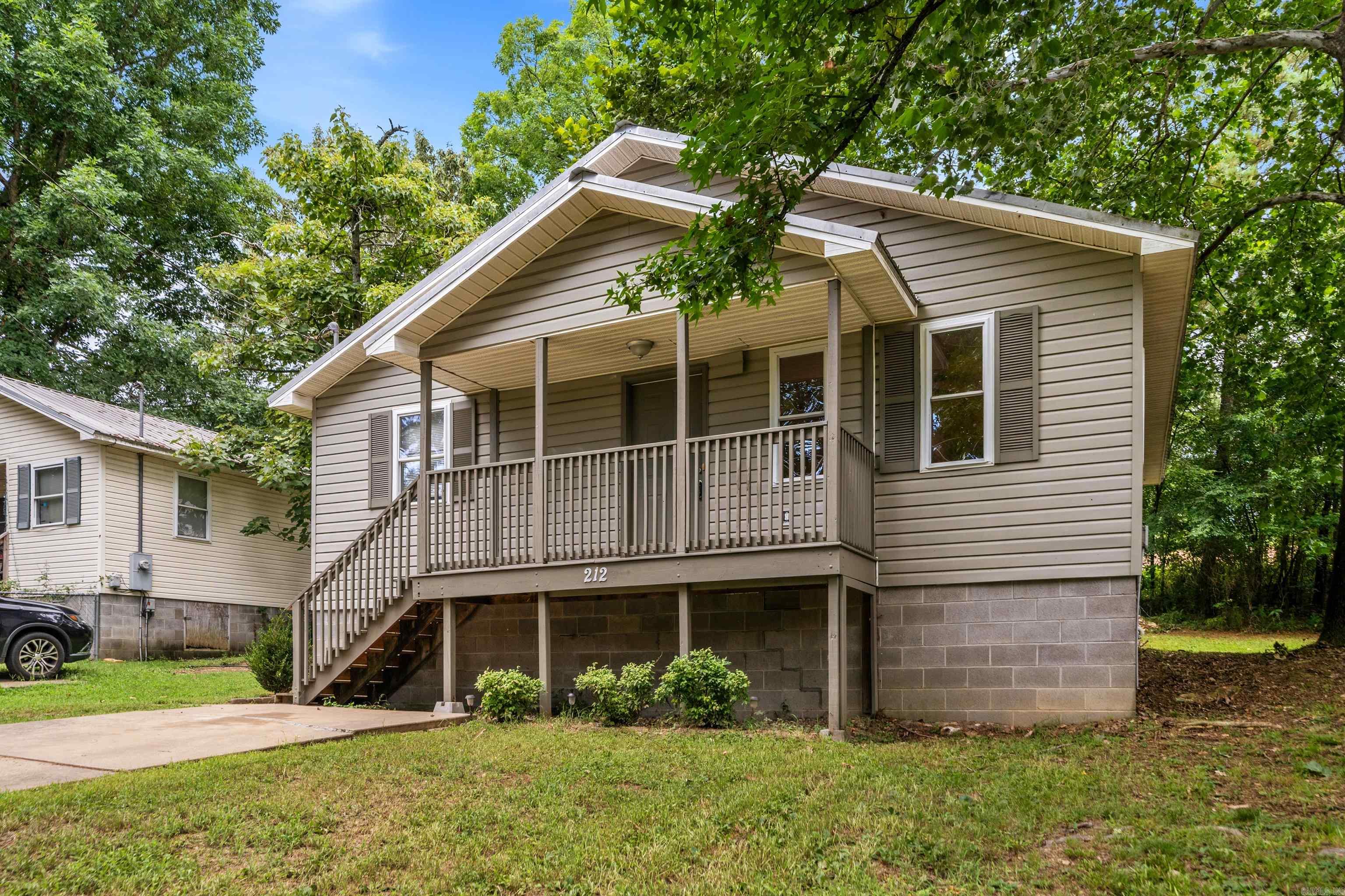 Welcome home to 212 Bayard St! Ideally situated directly across the street from a local park and just a short walk to the Hot Springs Greenway Trail, this property offers incredible access to outdoor recreation and green space. Inside, you’ll find a functional floor plan featuring 3 comfortable bedrooms, 1 full bathroom, plus a dedicated home office space. Key features include a low-maintenance, durable metal roof and a private, fully enclosed backyard ideal for pets, gardening, or relaxing outdoors. Perfect as a primary residence, starter home, or investment opportunity. Schedule your tour today!