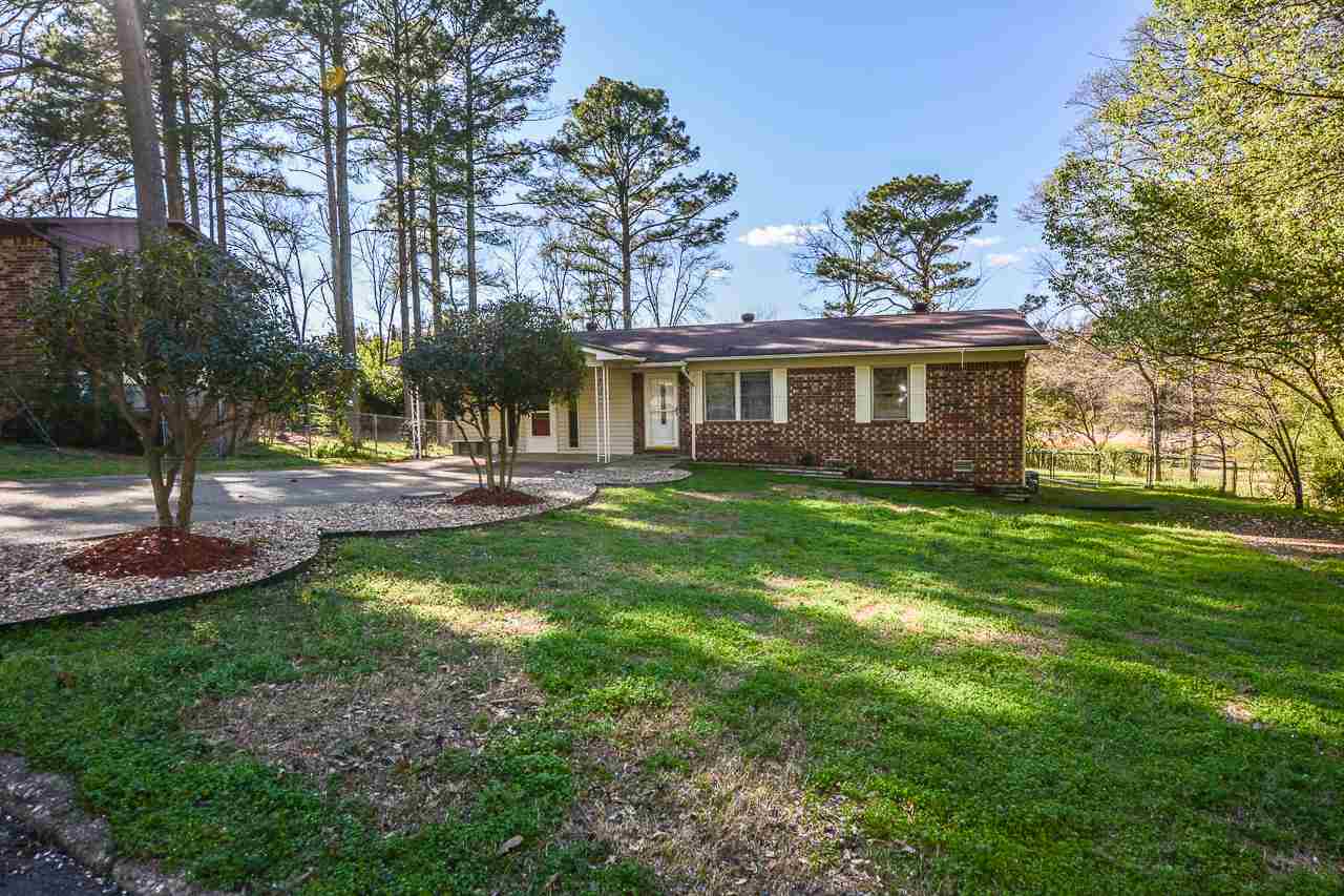Looking's free and buying's easy. This well-maintained one story brick home in a nice older neighborhood comes with a large fenced back yard, storage shed and two-car carport and it's only a minute's drive to the by-pass, making it convenient to everything!  It even has some handicap features (ramp and extra large bathroom with no-step shower) plus the third bedroom or bonus room is extra large with a second front entry, making it very convenient for anyone in the family with physical disabilities.