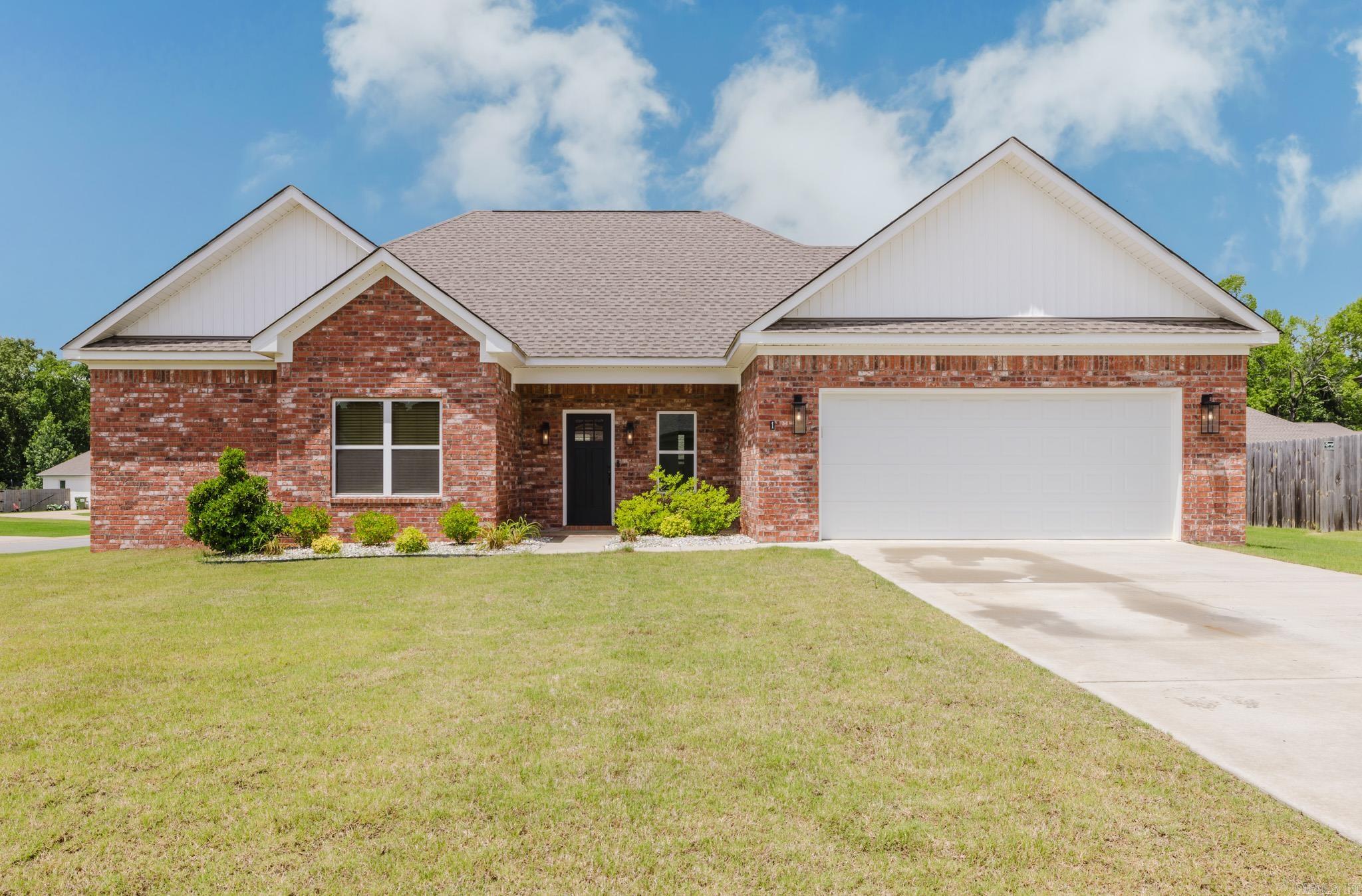 Built in 2023 and exceptionally maintained, this home combines an open layout, natural light, and thoughtful design. The kitchen features white cabinetry, granite countertops, and a herringbone tile backsplash. The spacious primary suite is separated from the secondary bedrooms and includes a soaking tub, walk-in shower, and laundry room access through the closet. Neutral finishes and an electric fireplace create a clean, move-in-ready feel throughout the home. Outside, the corner lot offers a fenced backyard, covered patio, river rock landscaping, and a welcoming neighborhood setting just minutes from Conway and Greenbrier amenities.