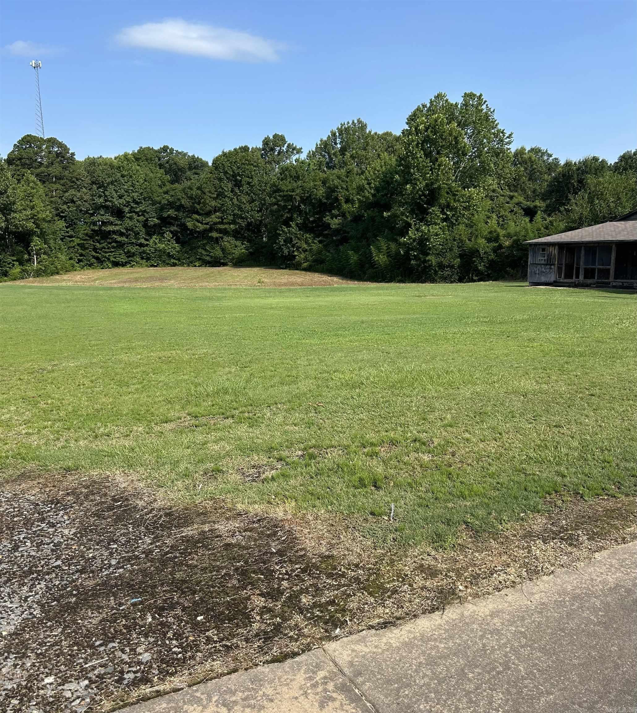 Level land ** any type of commercial ** ready to go  ** no value on house on property ** utilities on property **