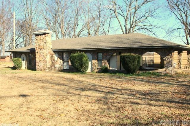 Great one level home with private access to Old River Lake. You can fish, swim, ski etc. whenever you want! This 3 bedroom, 2 bath country home on a approx 1/2 acre lot has a split floor plan. You can entertain lots of people in the large living room featuring a  wood burning fireplace & a rock dry bar. Large, open eat in kitchen opens into the partially fenced back yard. The laundry room w/sink is off the carport with even more storage. Lots of parking and separate storage building. see remarks