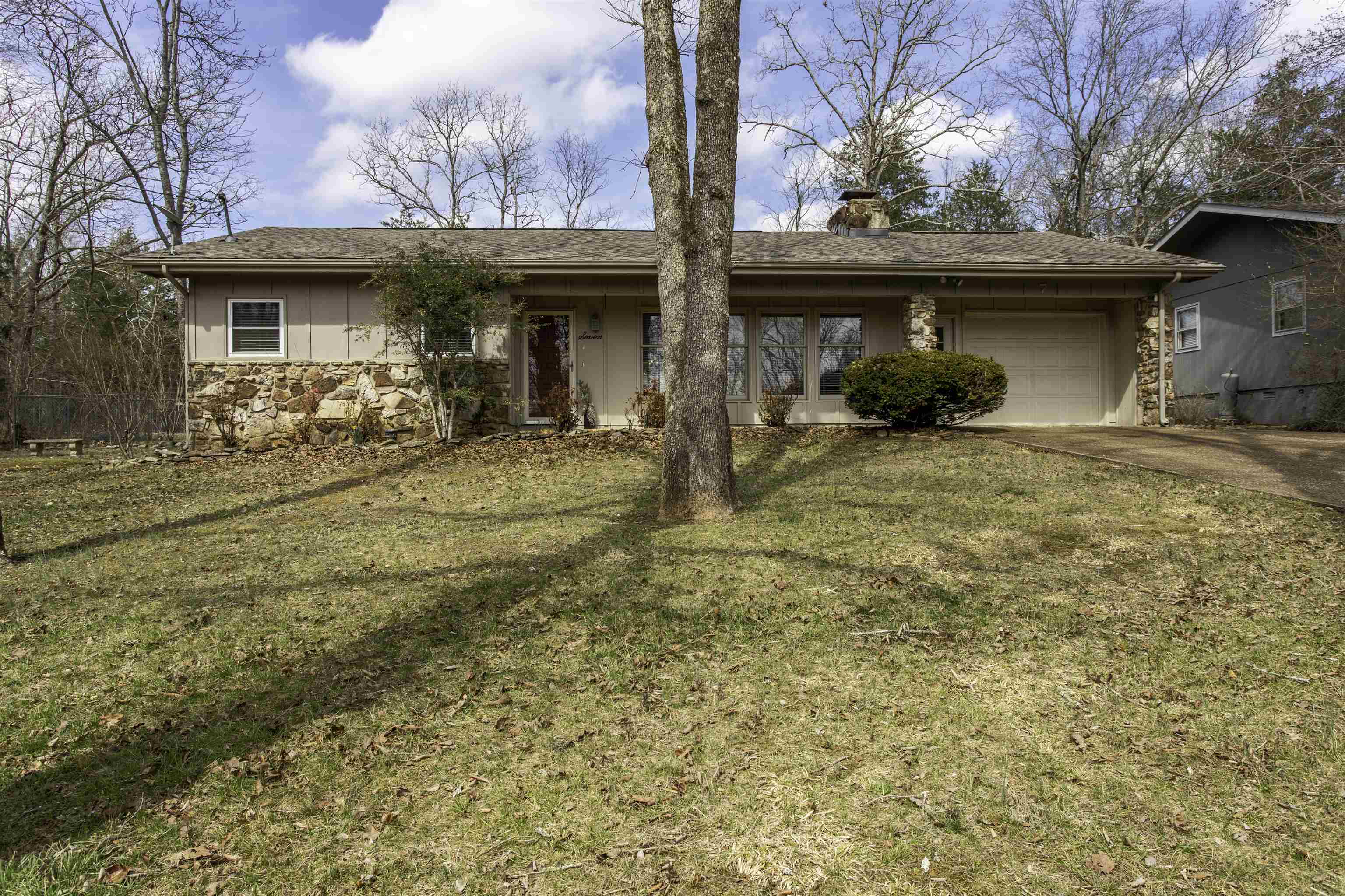 Located at 7 Winnebago Dr in Cherokee Village, Arkansas, this charming one-level home offers comfort, convenience, and proximity to **Lake Thunderbird**. Situated directly across from Wétapo Park, a public access point to the lake, this property provides easy access to fishing, kayaking, and relaxing by the water. The home even offers some seasonal lake views, adding to its appeal.  This 1,252 sq ft homefeatures 2 spacious bedrooms and 1.5 bathrooms, all on one level, plus a 2-car garage. Inside, you'll find a large living room, generously sized bedrooms, and an eat-in kitchen*with plenty of space for everyday meals. Step outside to enjoy the covered back patio, perfect for lounging or entertaining. Small fenced area for fur baby.  Major updates include a roof replaced in 2023 and HVAC installed in 2013. Located in the scenic community of Cherokee Village, residents enjoy access to 7 lakes, two golf courses, parks, and outdoor recreation,i included 2 recreational centers with in ground pool. Whether you're looking for a full-time residence, weekend vacation getaway, lake area home, or investment property, this location offers easy access to boating, fishing, golfing, and nature.