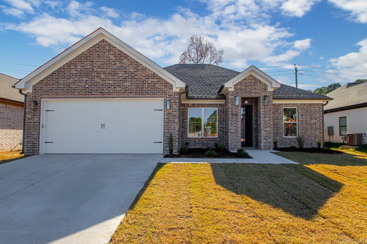 Welcome to your dream home in Benton’s premier subdivision, Spencer Crossing! This stunning brand new construction boasts a spacious split floor plan designed for modern living. Step into the heart of the home where custom-built, soft-close floor-to-ceiling cabinets adorn the kitchen, complemented by a freestanding stove & a convenient pantry for all your culinary needs. Cozy up by the brick gas fireplace in the open living area, perfect for entertaining or relaxing evenings at home. Retreat to the private primary suite featuring a luxurious primary bath complete with double vanities, and a large walk-in tile shower, offering a spa-like oasis right at home. The split floor plan ensures privacy with spacious spare bedrooms, providing ample space for family or guests. Step outside onto the covered porch & immerse yourself in the tranquility of the backyard, where you’ll love spending time in the expansive, fully fenced outdoor living space. Whether it’s morning coffee or evening gatherings, this home offers the perfect setting for enjoying the outdoors. Don’t miss out on the opportunity to make this beautiful home yours!