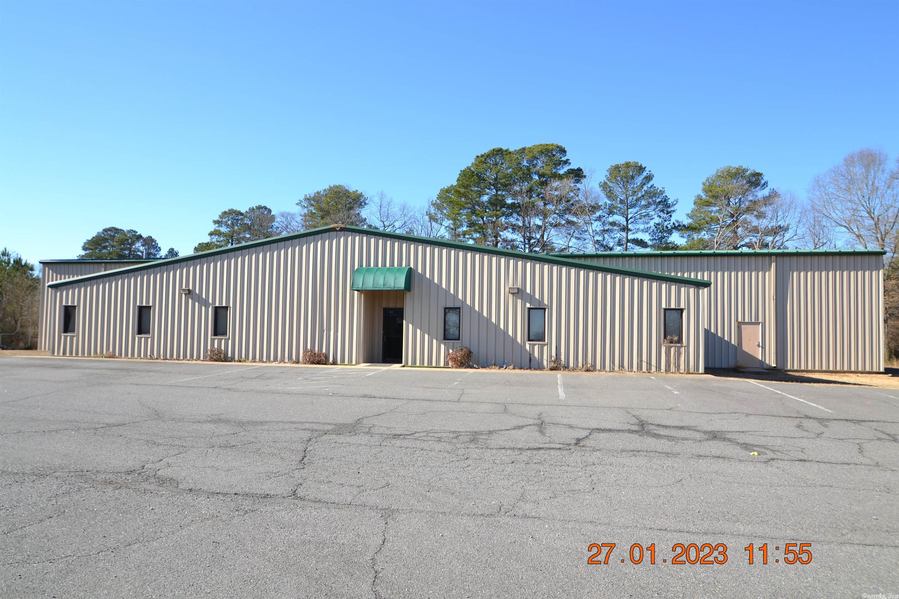 Desirable tract of level land ready for development. High visibility fronting Interstate 30 (approx. 311' frontage) and Highway 5 (approx. 450' frontage).  Great location with lots of potential.  Multipurpose steel building has approx. 14,595 sf w/offices, kitchen area, public restrooms & large open floor area. Storage area has overhead door. SEE AGENT REMARKS AND SHOWING REMARKS.