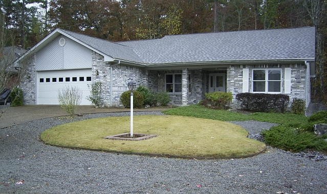 All brick home with a split floor plan. Open living area with vaulted ceiling and wood stove insert to keep it cozy. There is a huge covered back patio plus a 2.5 car garage to store all of your toys. This is a Fannie Mae property and can be found on homepath.com.