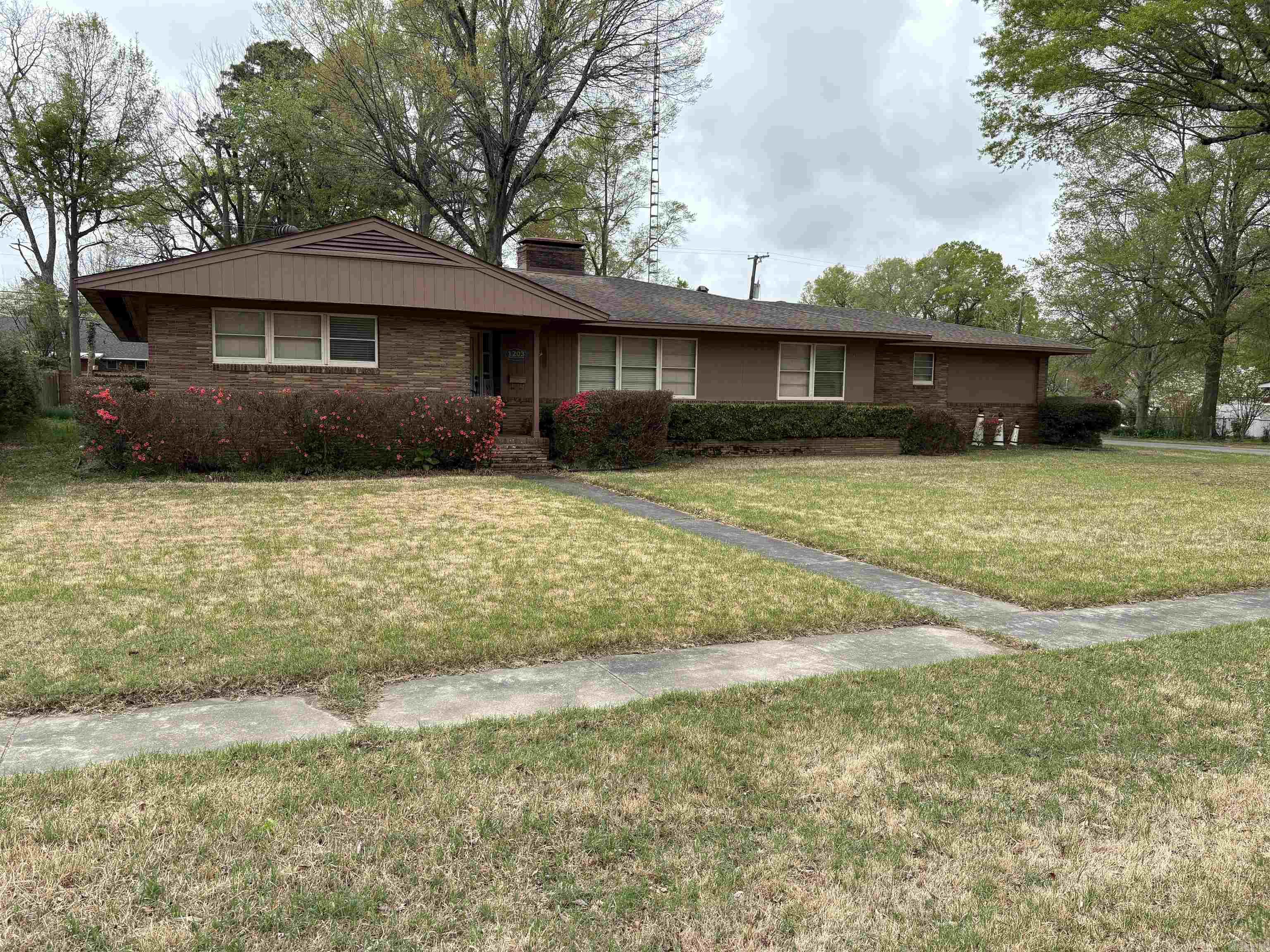 Welcome to the market this beautiful home.  Featuring 3 Bed 3 bath and could possibly be a 4 or 5 Bedroom.  Gilmore Custom kitchen 3 Car carport Small workshop off carport  Corner Lot with good size yard Gas and wood fireplace Laundry Room  This is a As-is sell and could use some updating