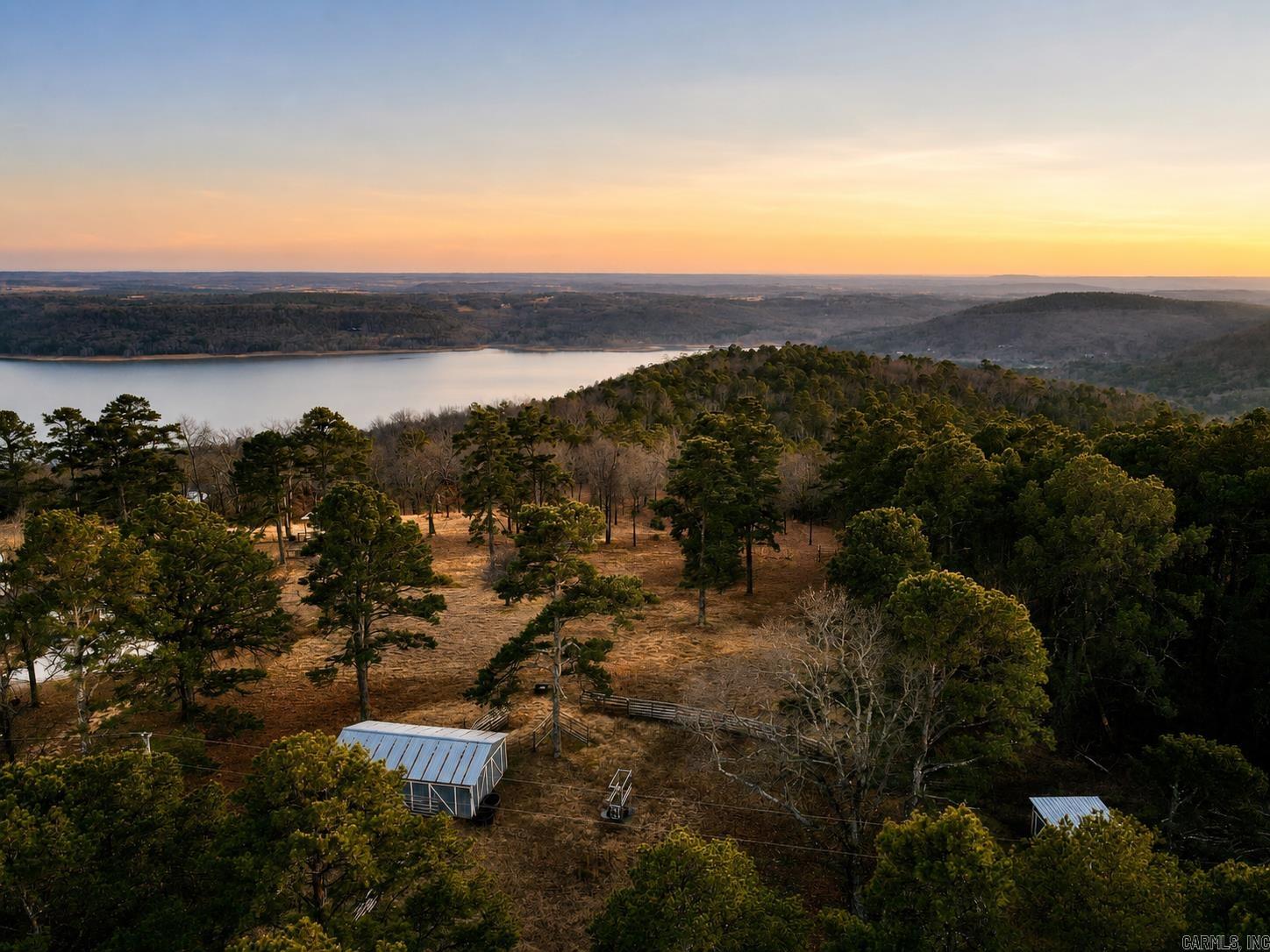 Discover the ideal setting for your dream home on this 5.65-acre property overlooking Greers Ferry Lake and the surrounding mountains. Offering a rare blend of usable acreage and lake views, this lot provides both privacy and convenience. Electricity is already on the property, and water is available at the road, making it ready for your vision to take shape. Located less than 20 minutes from Quitman Public Schools, just 6 minutes from Miller Point Boat Launch, and approximately 20 minutes from Sugarloaf Marina, you’ll have quick access to boating, fishing, and everything Greers Ferry Lake has to offer while still enjoying country living. Come walk the property and experience it for yourself. See drone video Link: https://youtu.be/QgX92JnqqCI