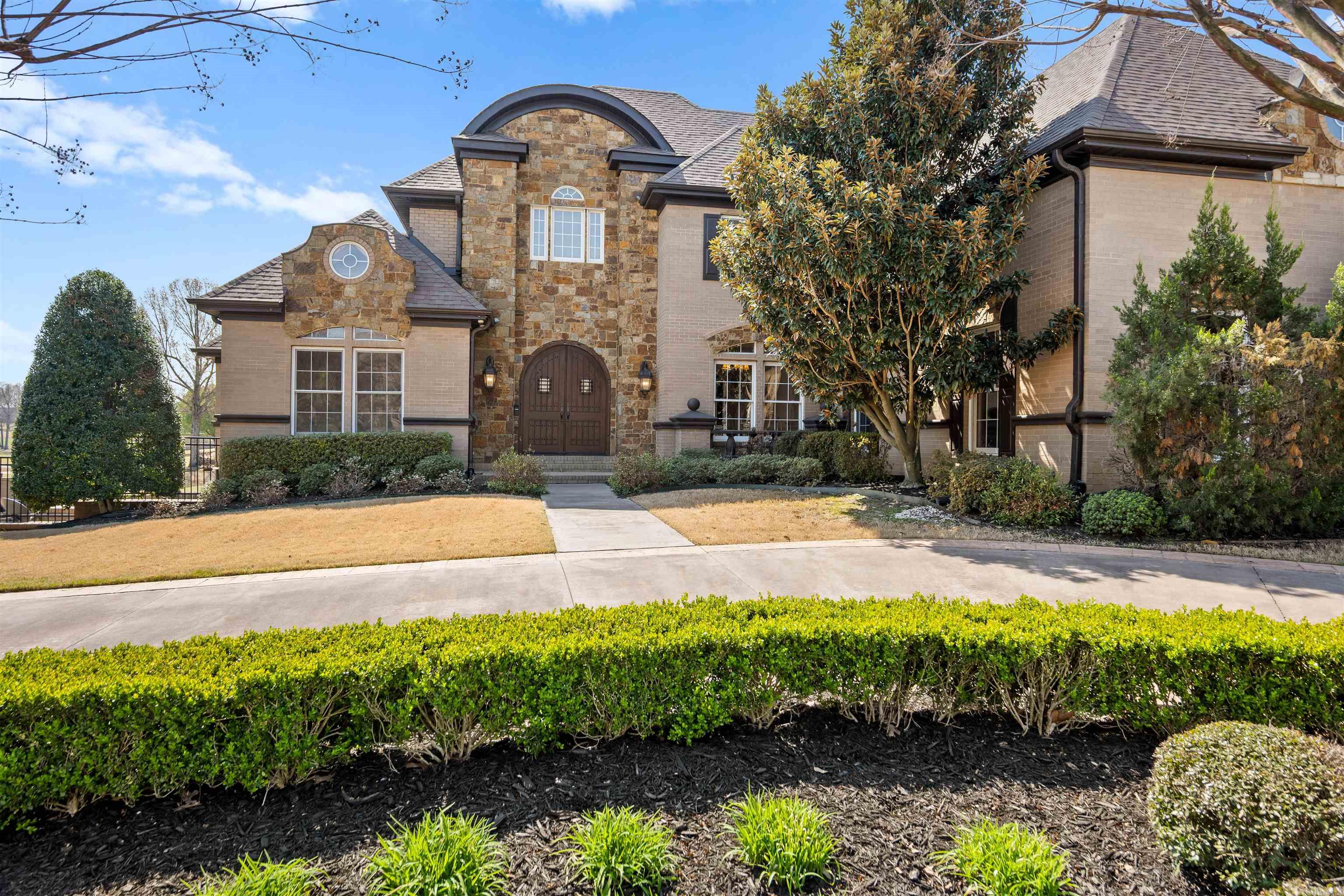 Your dream home awaits! If you've ever imagined the perfect space for both indoor & outdoor entertaining, this exceptional property delivers beyond expectations. From breathtaking views overlooking the Ridgepointe Golf Course to resort-style amenities, every detail is designed to impress.  Step outside and experience a true entertainer's paradise featuring a spacious pool with a stunning water fountain, multiple lounging areas, & a private basketball/pickleball court. The outdoor kitchen is fully equipped for unforgettable gatherings, complete with a large grill, wine cooler, dishwasher, & full-size refrigerator. Inside, elegance & functionality blend seamlessly. The gourmet kitchen boasts a Viking gas stove, pot filler, ice maker, and built-in espresso machine perfect for both everyday living and hosting. Enjoy cozy evenings by the fireplace or entertain in the formal dining and living rooms, complemented by a convenient butler's pantry. Additional highlights include a theater room for ultimate movie nights, 3 laundry rooms, rich hardwood flooring throughout, & a spacious three-car side-loading garage. Some pictures are virtually staged. Call or text today to schedule your tour!